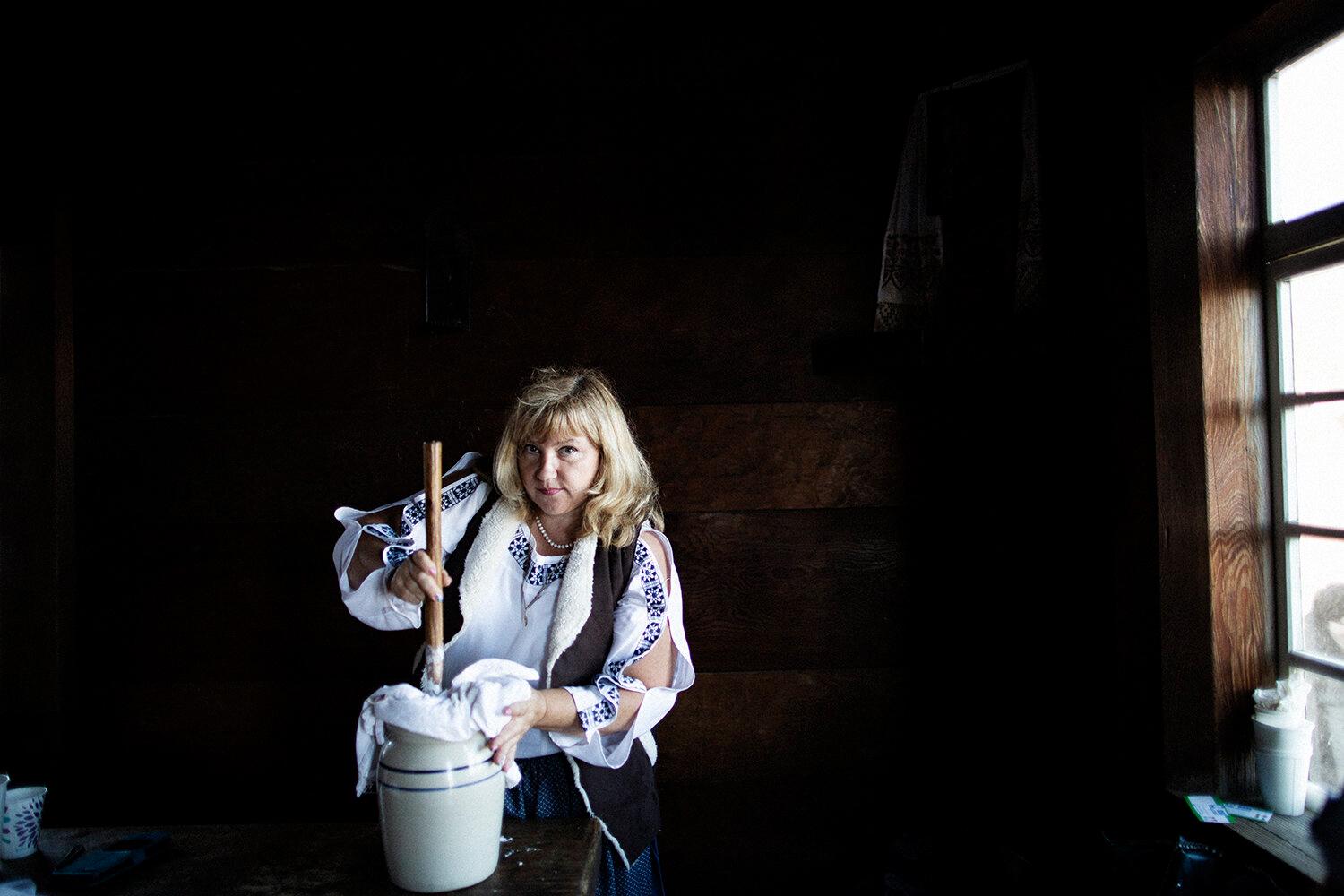 Svetlana Vershinina (from Russia, now lives in San Jose) making butter at the Fort Ross Festival...