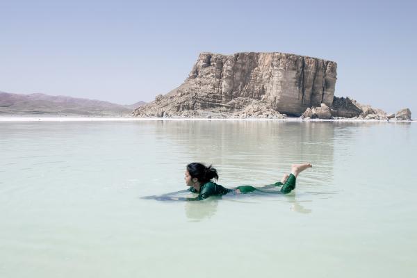 The Eyes of Earth - A girl is Swimming in shallow water in coast of Urmia salt lake,from olden times, local...