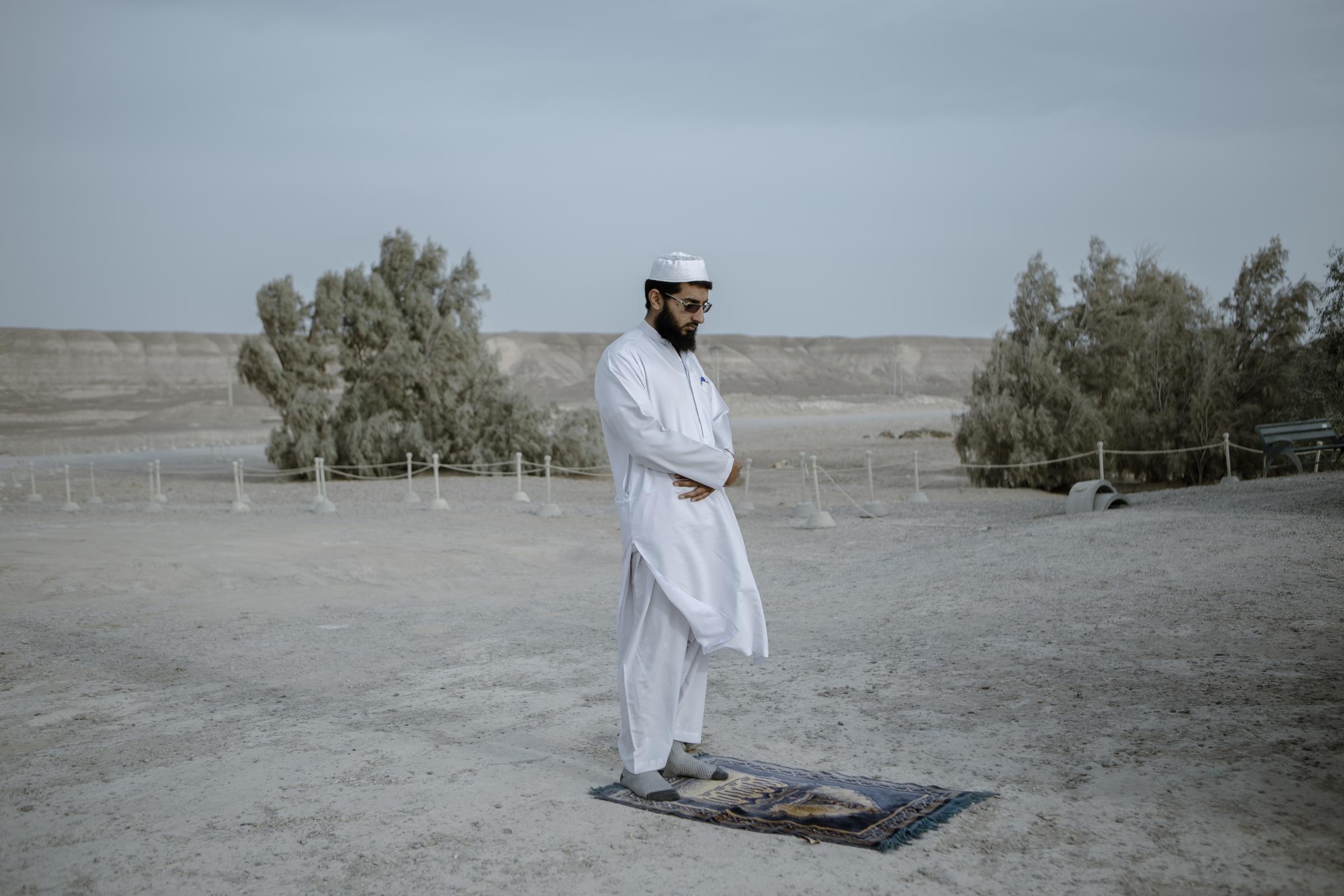 IN THE DESERT OF WETLANDS -   While praying in dried Hamun wetlands, Haji Mahmoud, a...