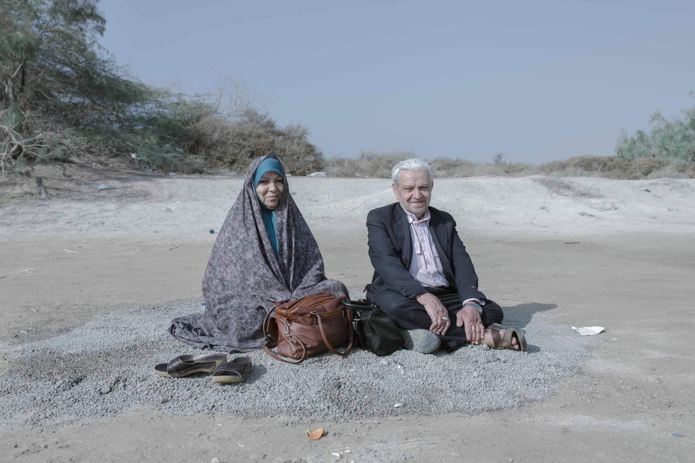 IN THE DESERT OF WETLANDS -   The couple rests on the coast of Pink lake(Lipar lake)...