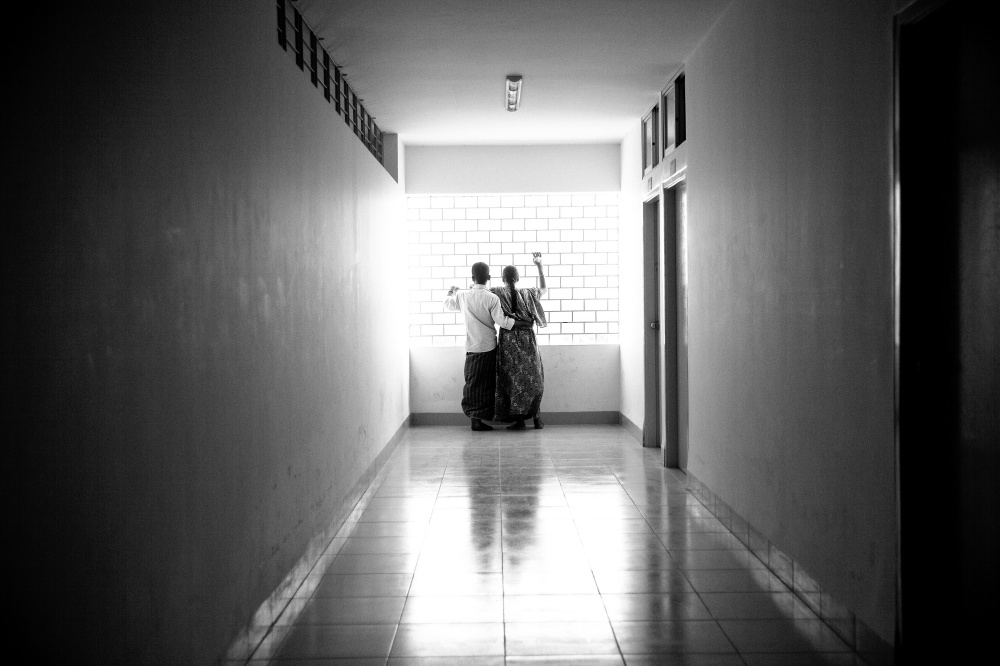 Shokhina with her husband Motin at Anam Medical College Hospital corridor. She worked in 6th floor at Rana Plaza and her both leg is seriously...