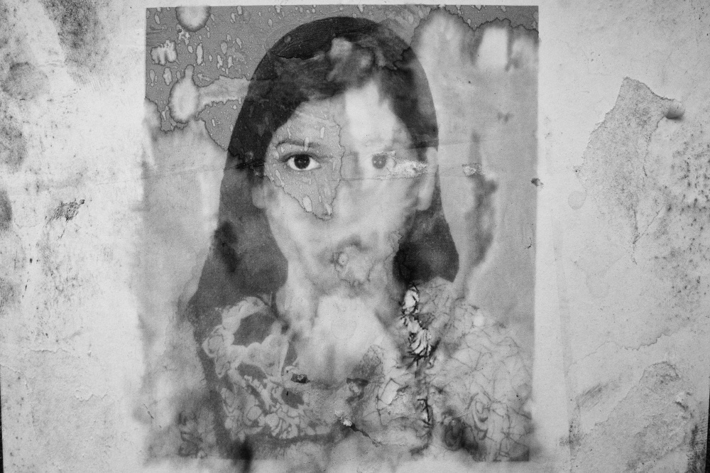 Under the rubble - Photograph of Asma Akhter, a missing Rana Plaza garment...