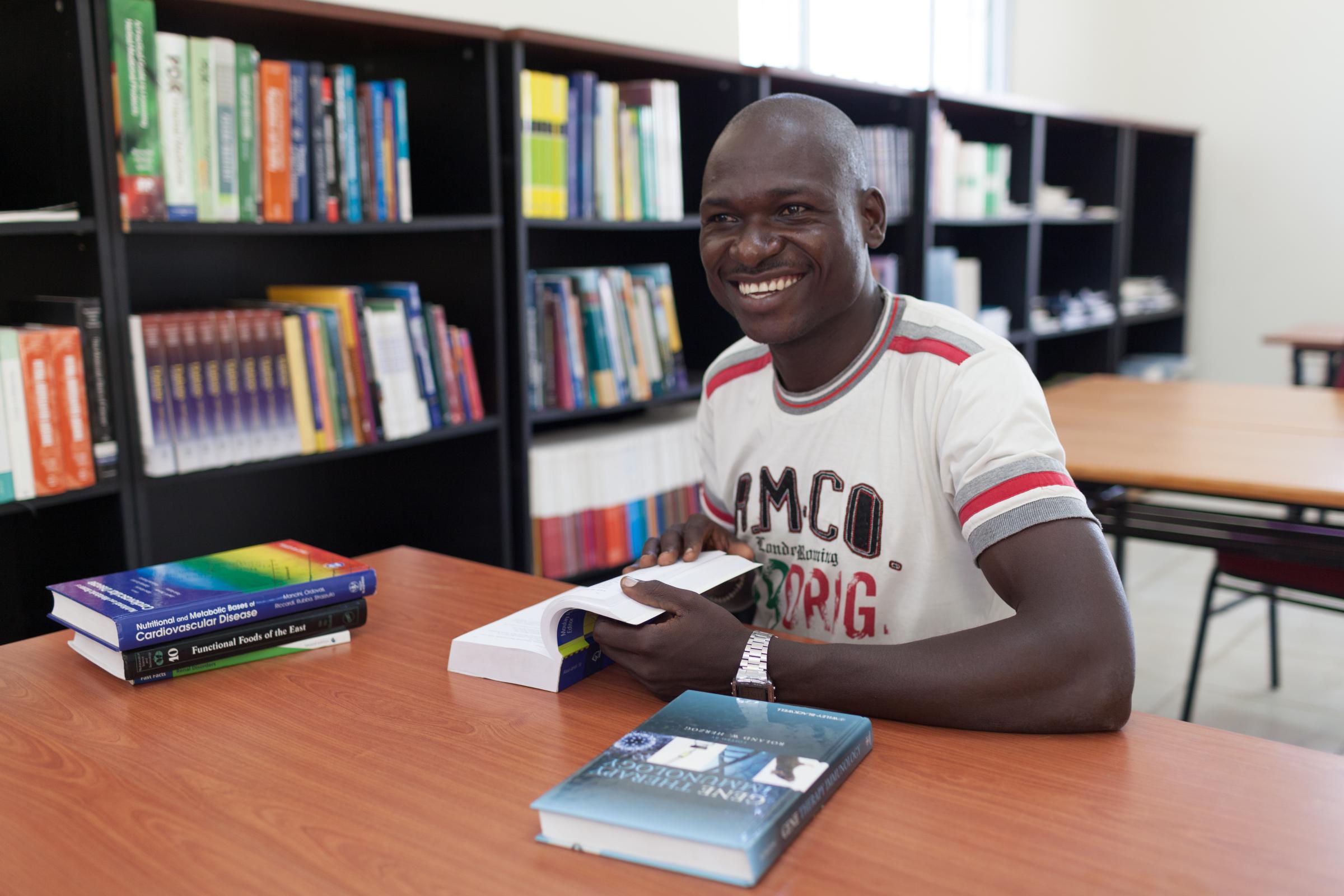 MIDWIVES: BRINGING HEALTH SERVICES CLOSER TO THE PEOPLE - Medicine student Ocan Walter, at the library of the College of Physicians and Surgeons in Juba...
