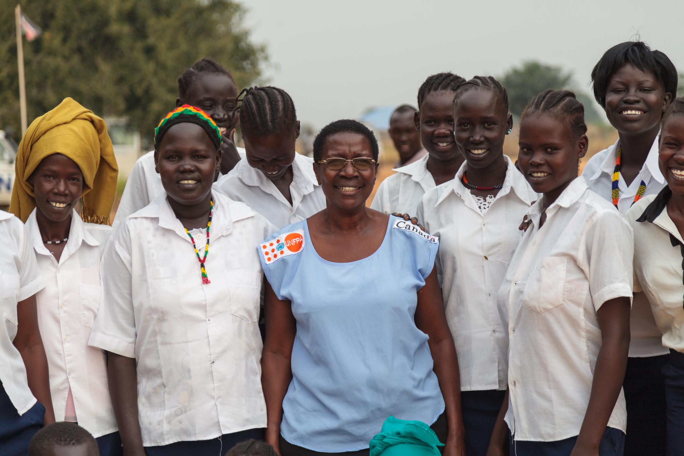 REINING IN THE NEXT GENERATION OF HEALTH PROFESSIONALS  - International UNFPA midwife Margaret Wakabi from Uganda among midwifery students at the Aweil...