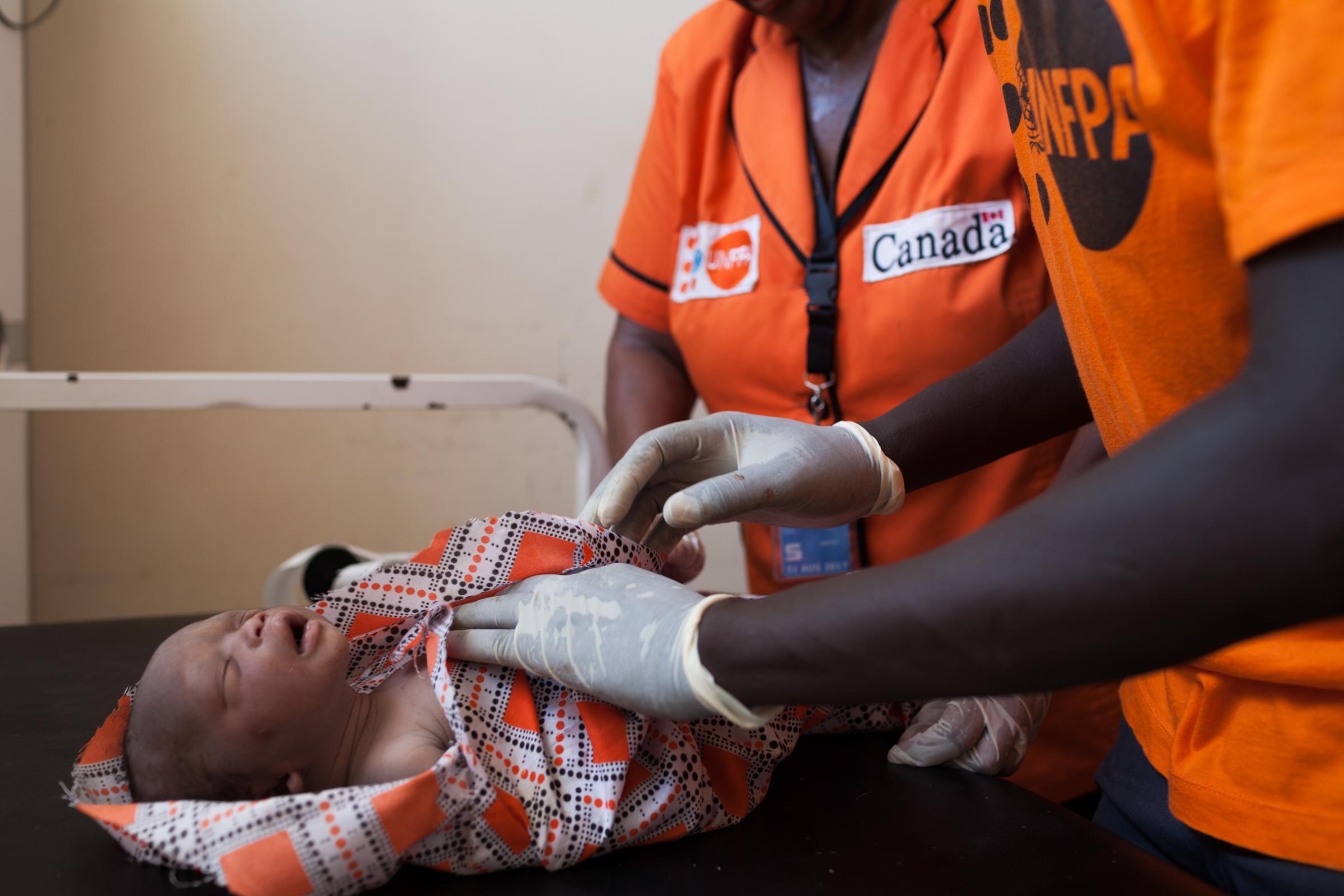  A SECOND CHANCE AT LIFE - UNFPA midwives Nelly Njenga and Wol Wol Daniel at Kiir Mayardit women&rsquo;s hospital...