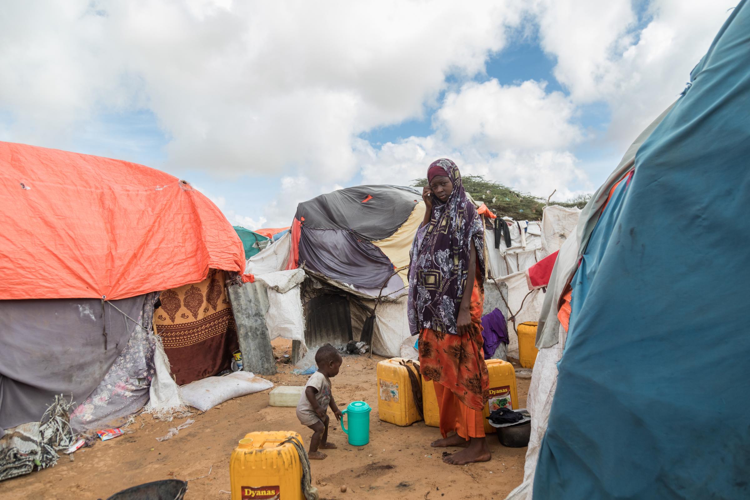 Facing the Dual Crisis: A Glimpse into the Lives of Women and Children in Somalia's Kahda District IDP Camp - Rukyo Abbas, an 18-year-old mother of a year and a half-old child, stands on the verge of her...