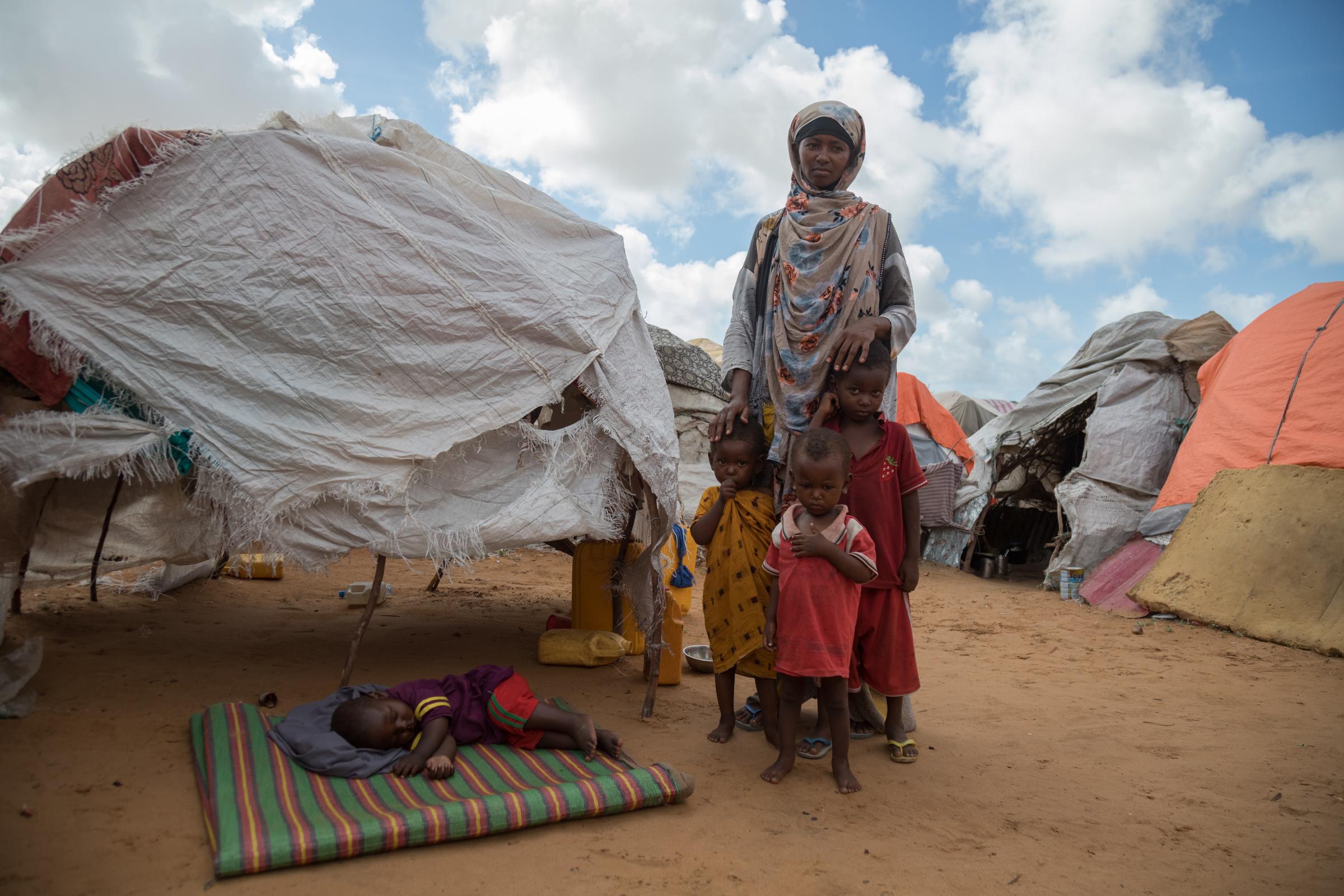 Facing the Dual Crisis: A Glimpse into the Lives of Women and Children in Somalia's Kahda District IDP Camp - Hawa Aden, a 33-year-old mother of four, fled the conflict and water scarcity in Lower Shabelle,...