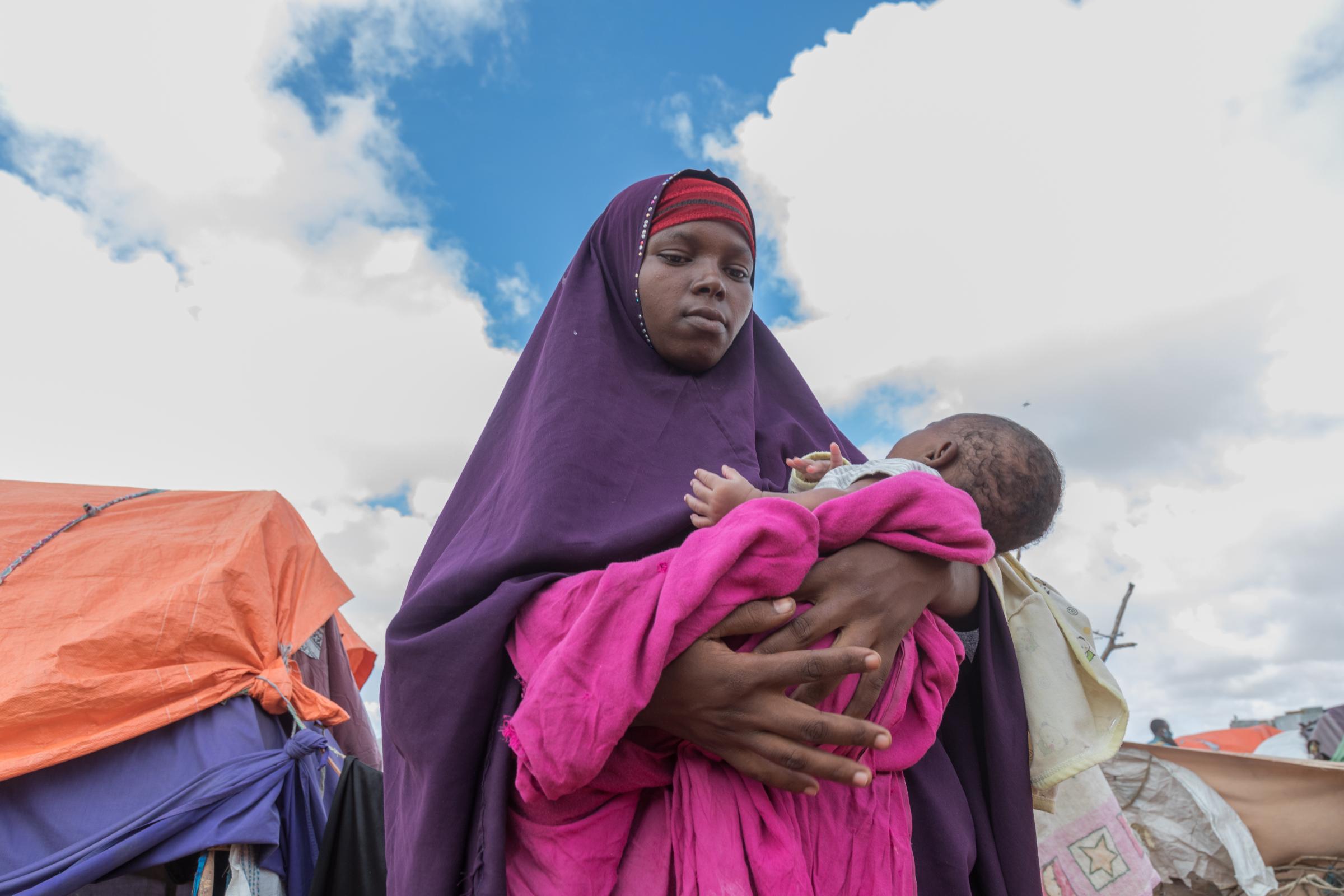 Facing the Dual Crisis: A Glimpse into the Lives of Women and Children in Somalia's Kahda District IDP Camp - Fahmo Abbas, a 27-year-old mother, fled from Lower Shabelle, seeking safety and refuge amidst...