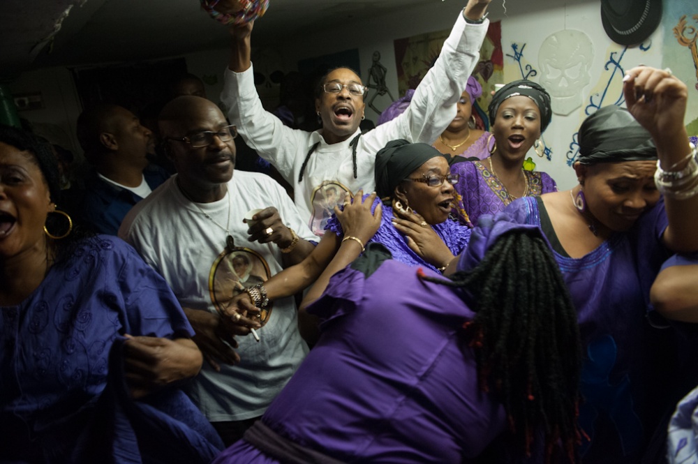  Vodou practitioners sing songs...th and Resurrection, is feted. 