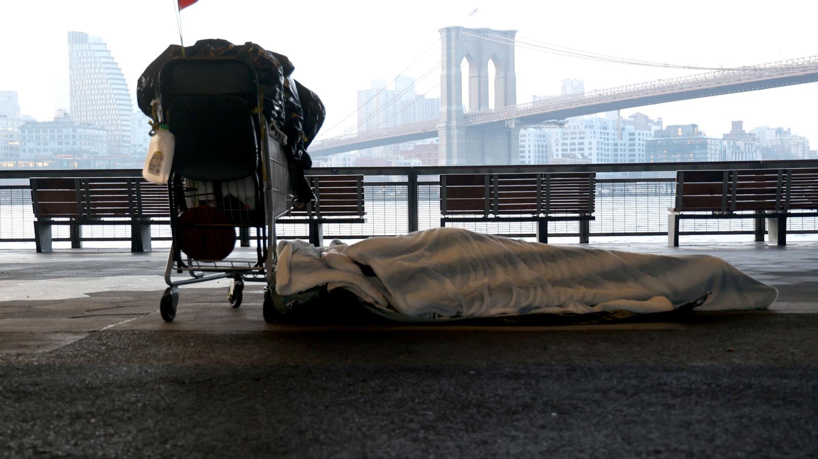 Homeless person sleeps in the cold