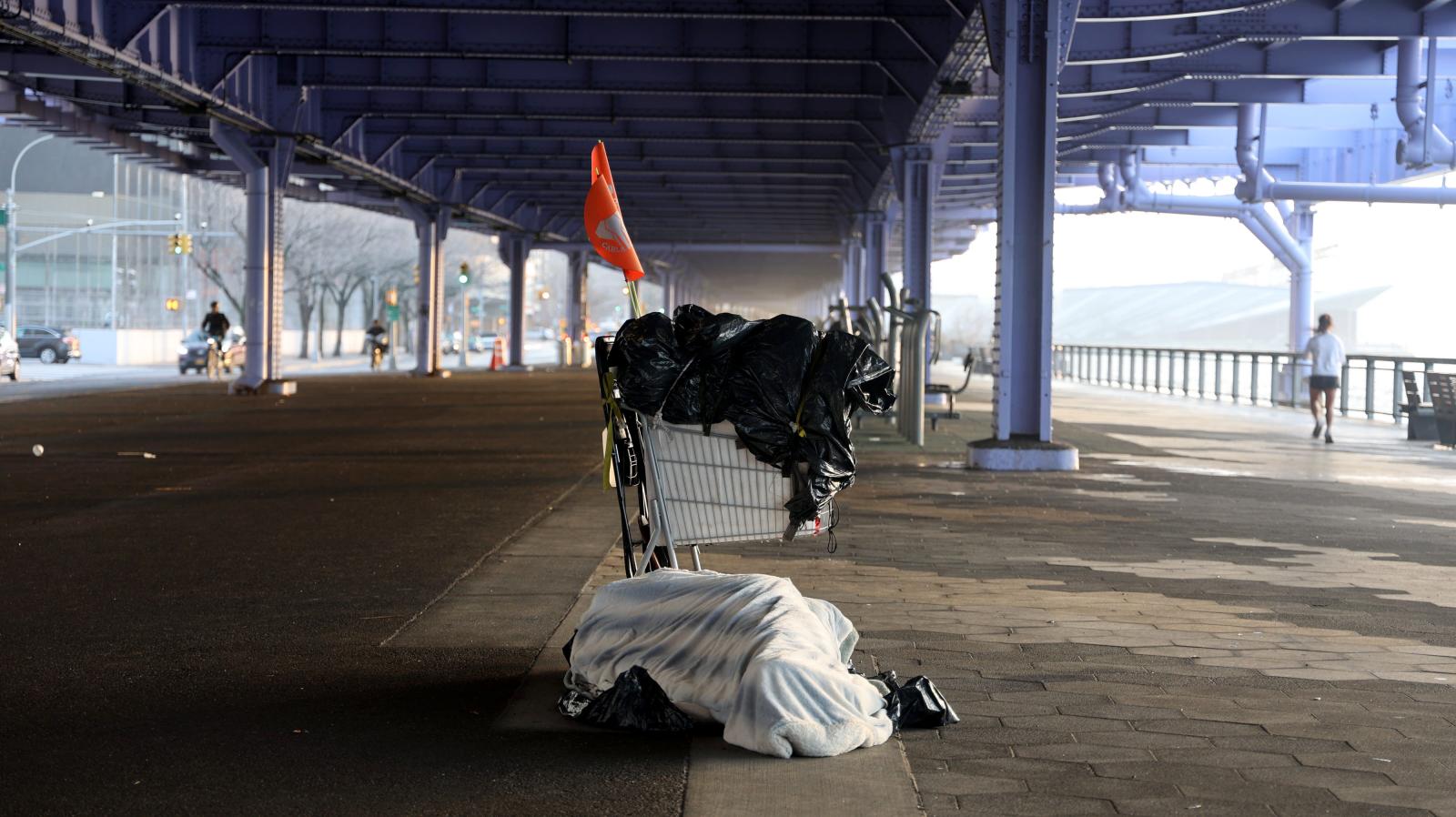 Homeless person sleeps in the cold