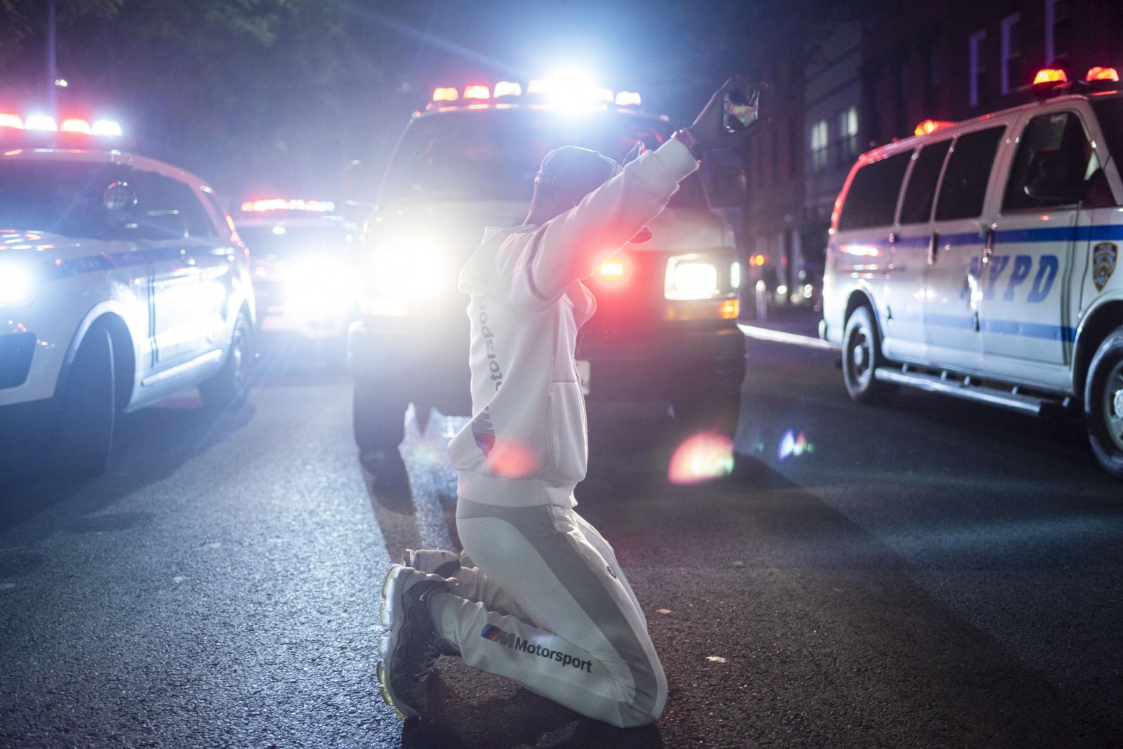 Image from NYC: MidiaNinja - A man is being detained during a protest for the death of...