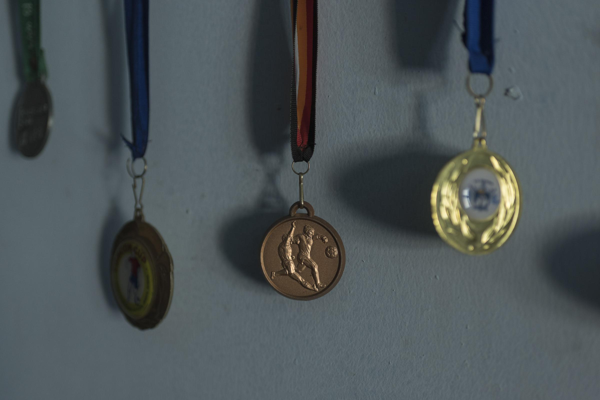 VII ACADEMY - VII Foundation - Medals from local soccer tournaments belonging to Manuel....