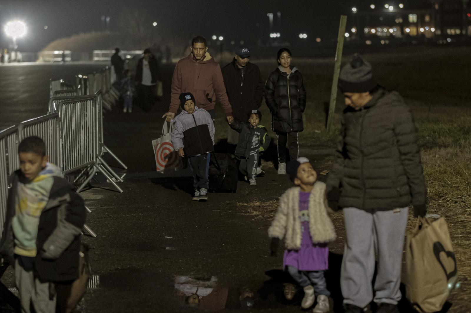 Families arriving on Christmas ...orough of Queens, New York, US.