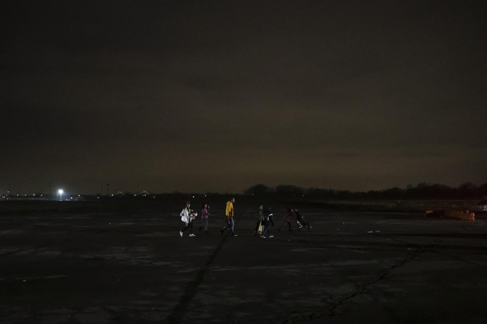 Families arriving on Christmas ...orough of Queens, New York, US.