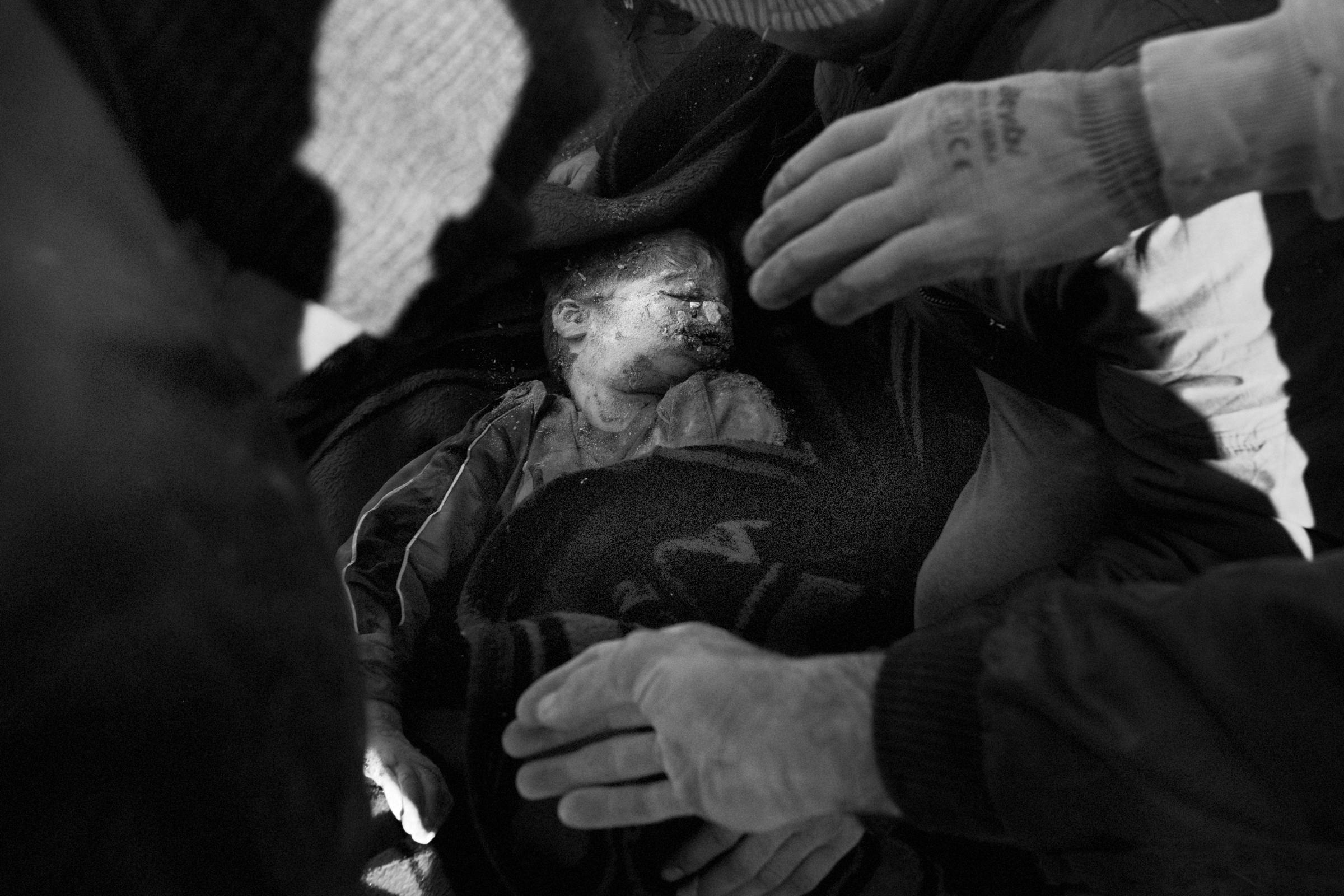 The body of 5 y.o. Zaid which his father Bashar dug up from the rubbles with his own hands. The rescuers arrived only the next days and locals had...