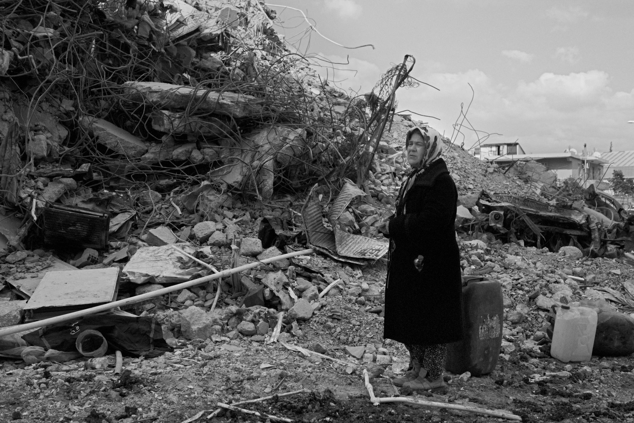 Earthquake in Turkey (2023) - Elif, 65 y.o., stands on the rubbles of her collapsed...