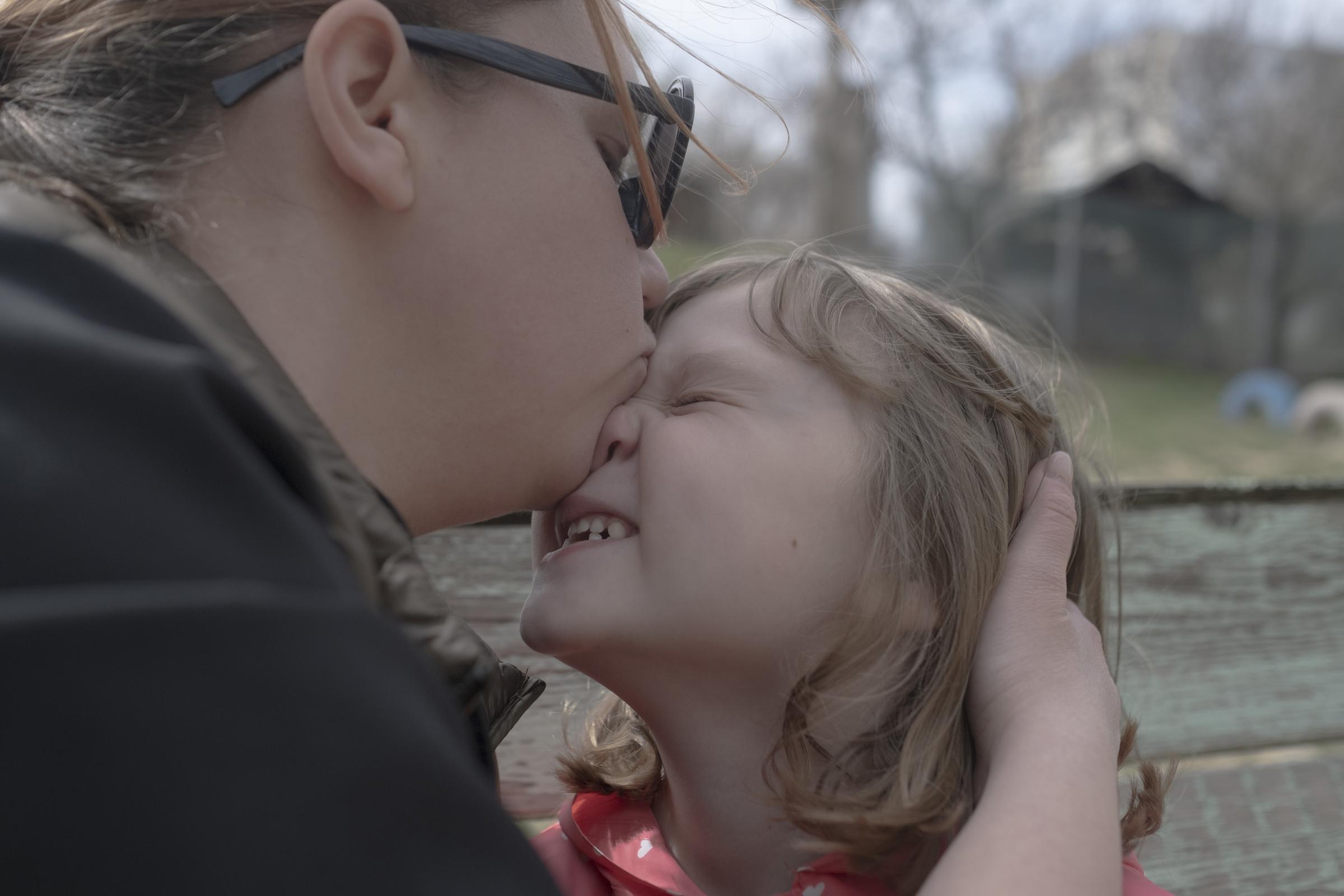 Moldovans who sheltered Ukrainian refugees at home - Katya kisses Marusya during a walk