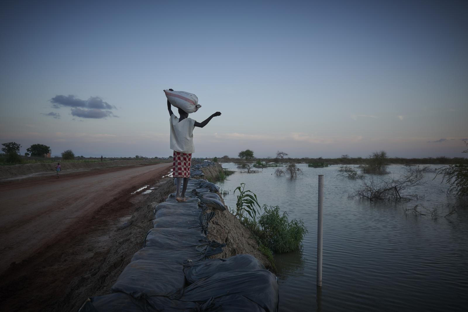 A young girl walks along the ap...2022 Bentiu South Sudan / Sudan