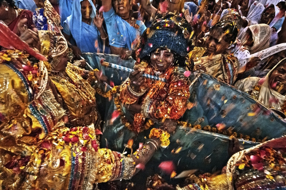 Path breaking move - A widow dressed up like Krishna, the god of love, dances...
