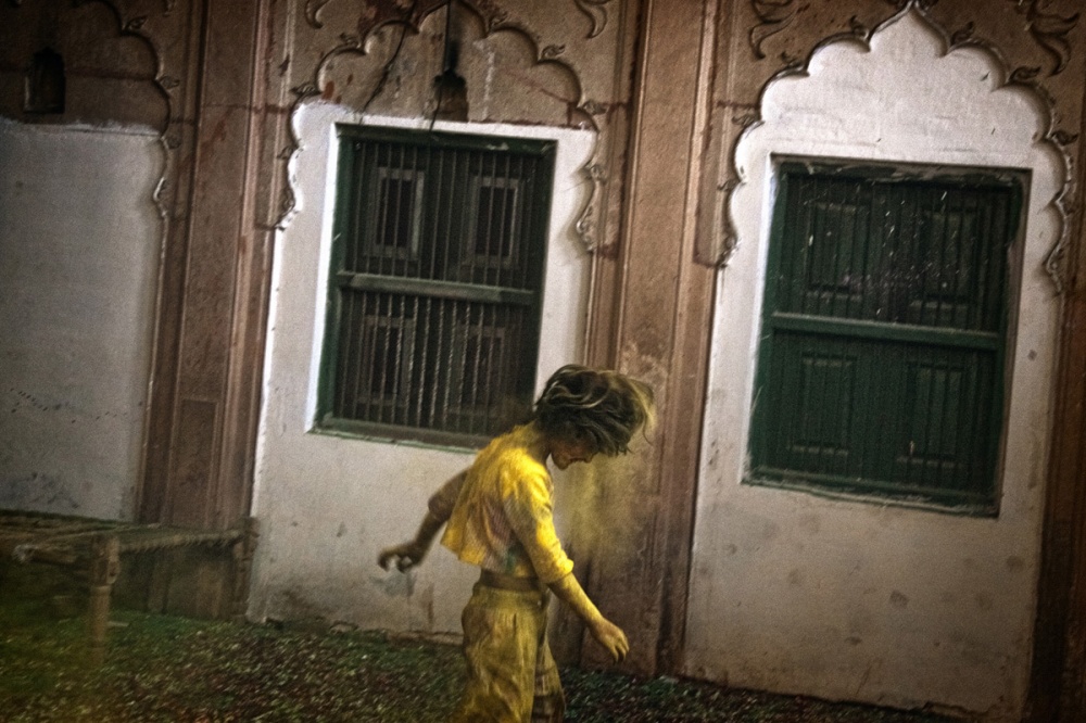 Path breaking move - A girl shakes her head from the yellow powder in the hall...