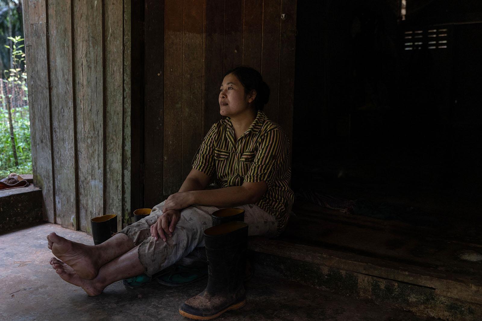 LIFE ON THE OTHER SIDE - Surat Thani - Migrant worker Cho Mon Aung, 36, sits in...