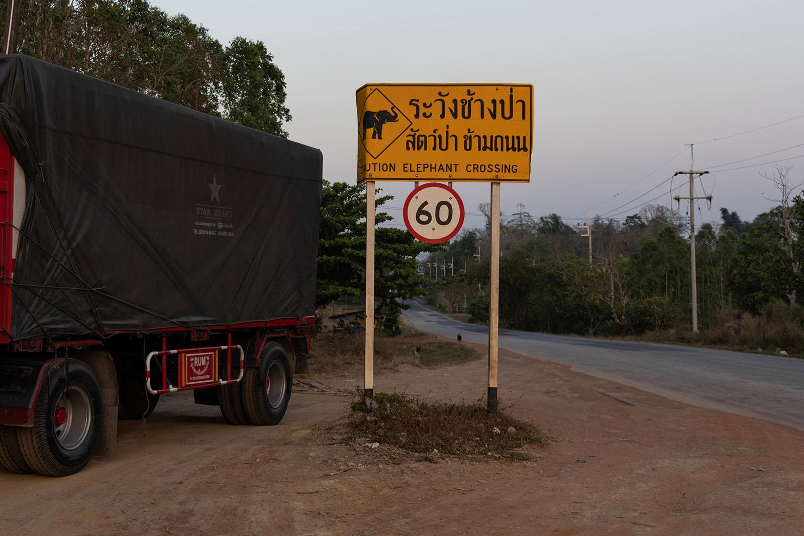 A FRAGILE COEXISTENCE - A sign warns motorists of the presence of wild elephants...