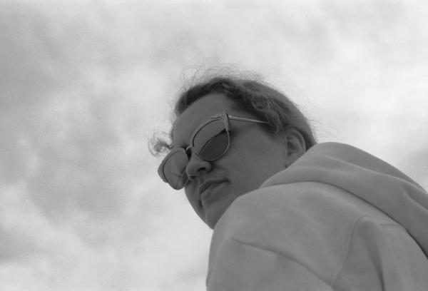 Zandra on the cabin porch, New Hampshire, May 2021