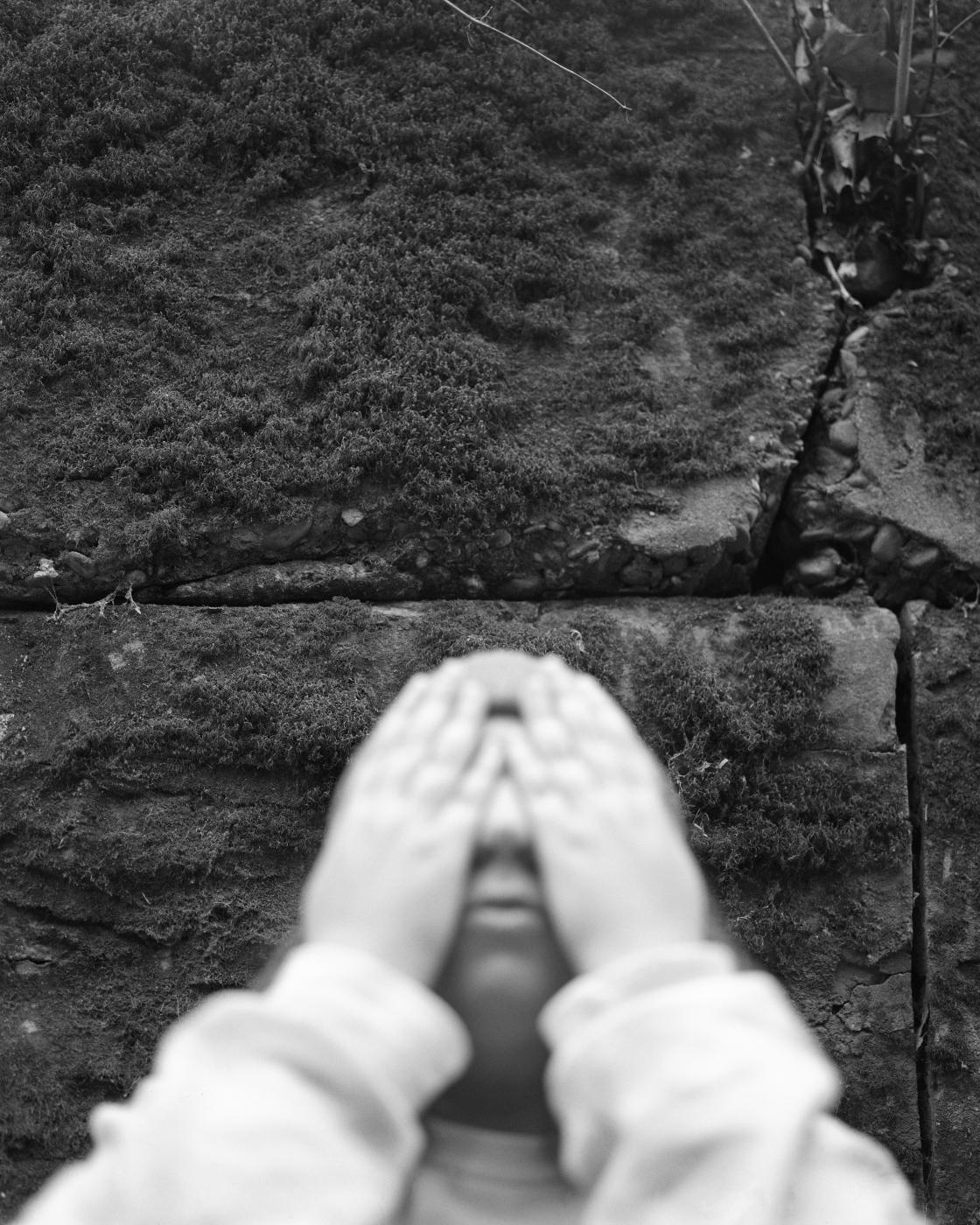 Image from Black & White  - Angela in front of a moss wall, December 2023