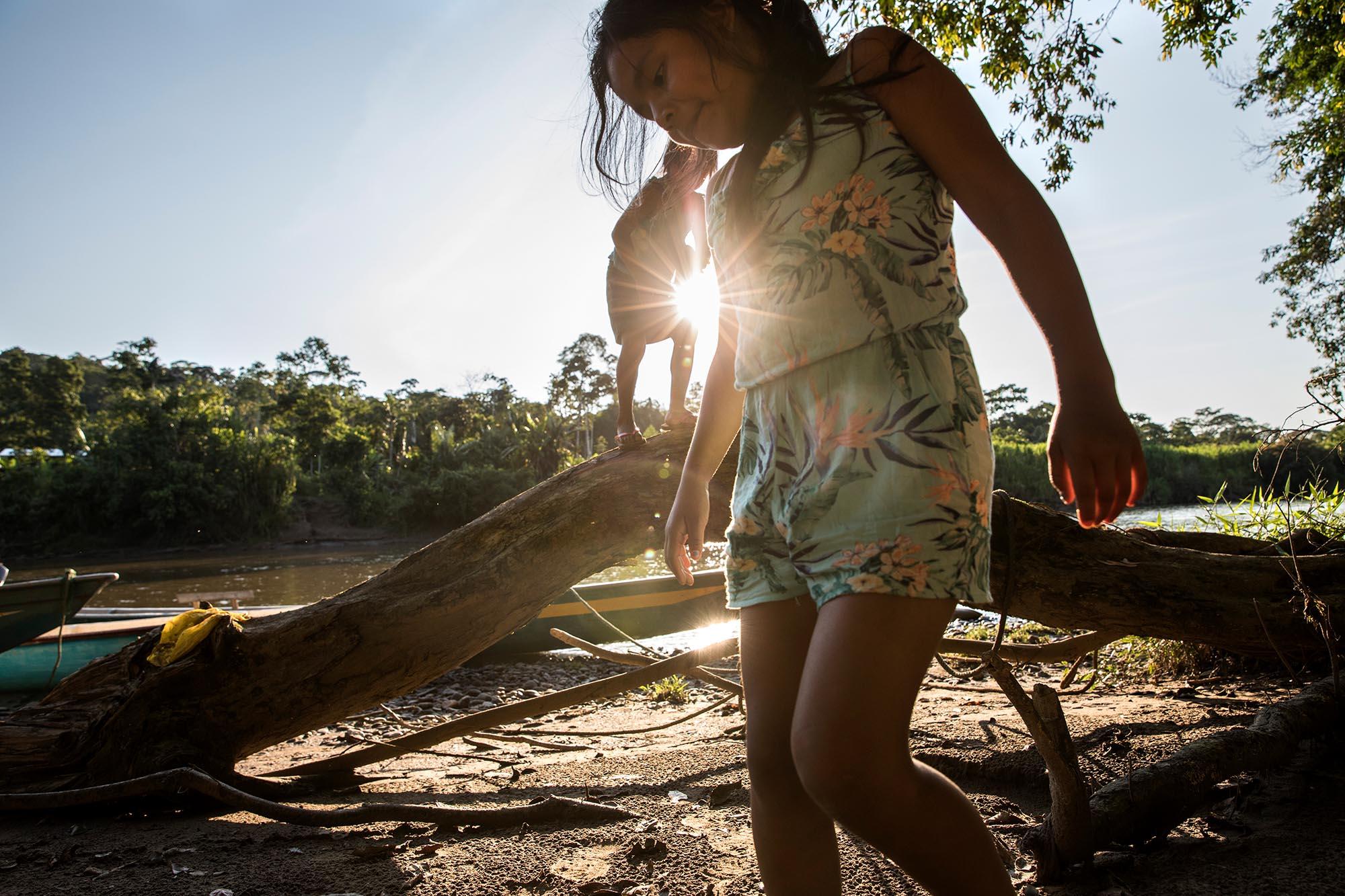 Ecuador, the living forest - Walkanga and jade are playing by the water. Children...