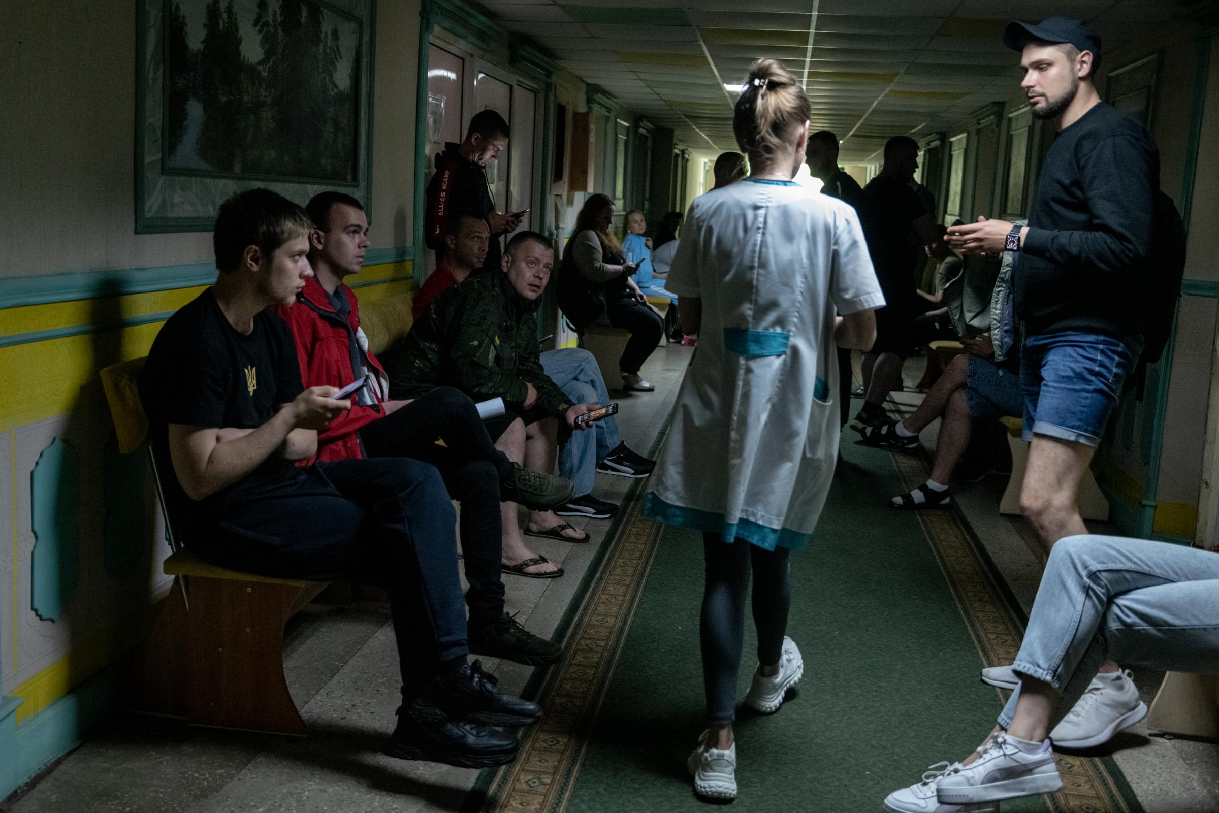 The Hidden Trauma of Ukraine's Soldiers - Ukrainian soldiers lined a hallway while waiting for...