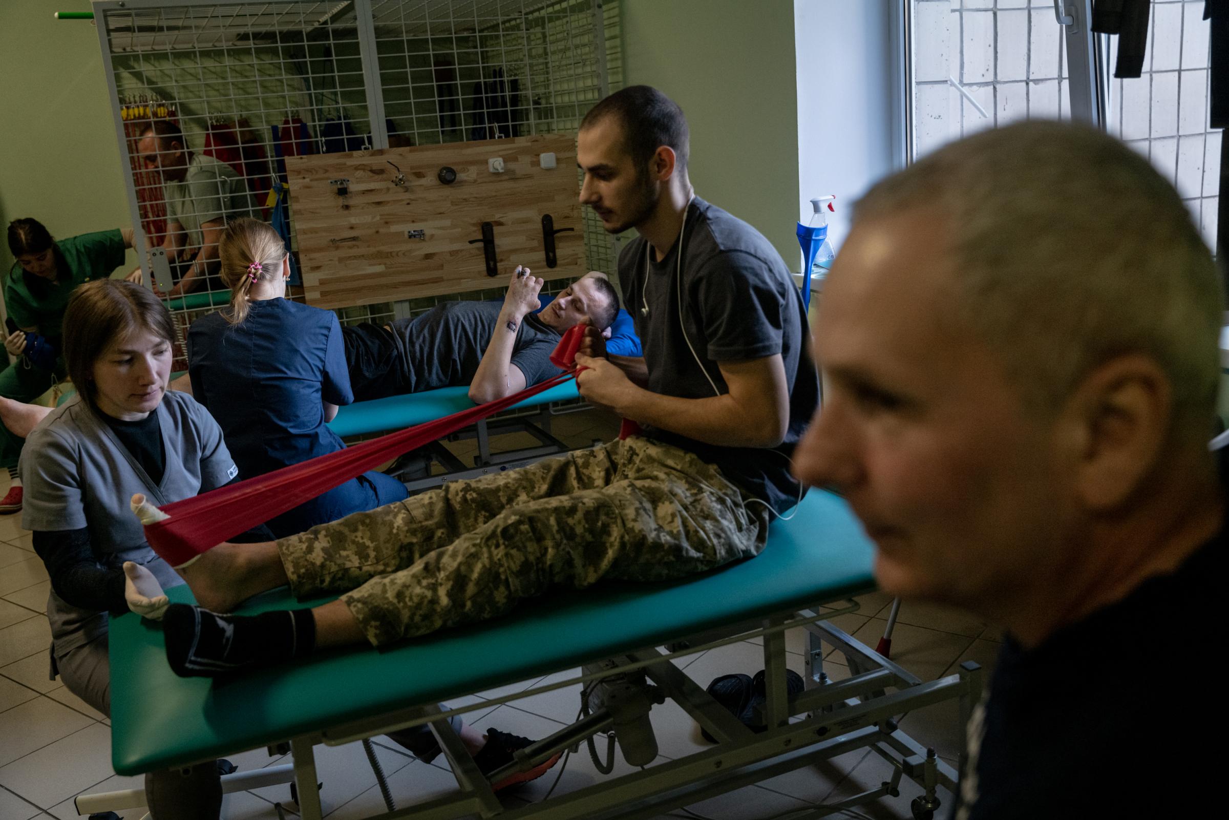 The Hidden Trauma of Ukraine's Soldiers - Ukrainian service members are seen during a physical...
