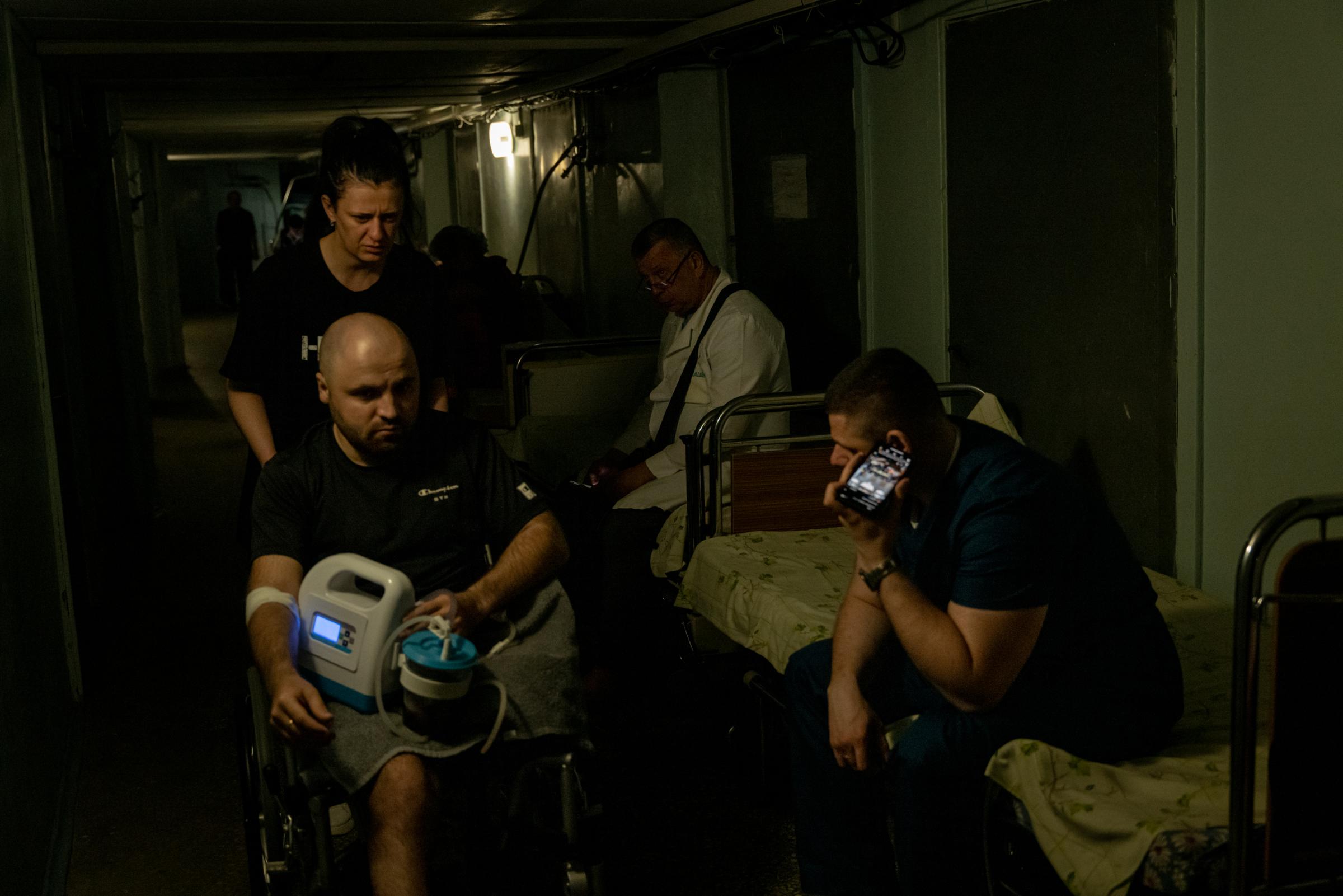 The Hidden Trauma of Ukraine's Soldiers - A wounded Ukrainian service member is seen sheltering in...