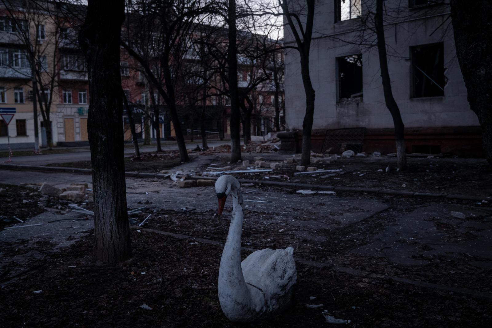 A damaged statue of a swan is s... by the Russian military since.