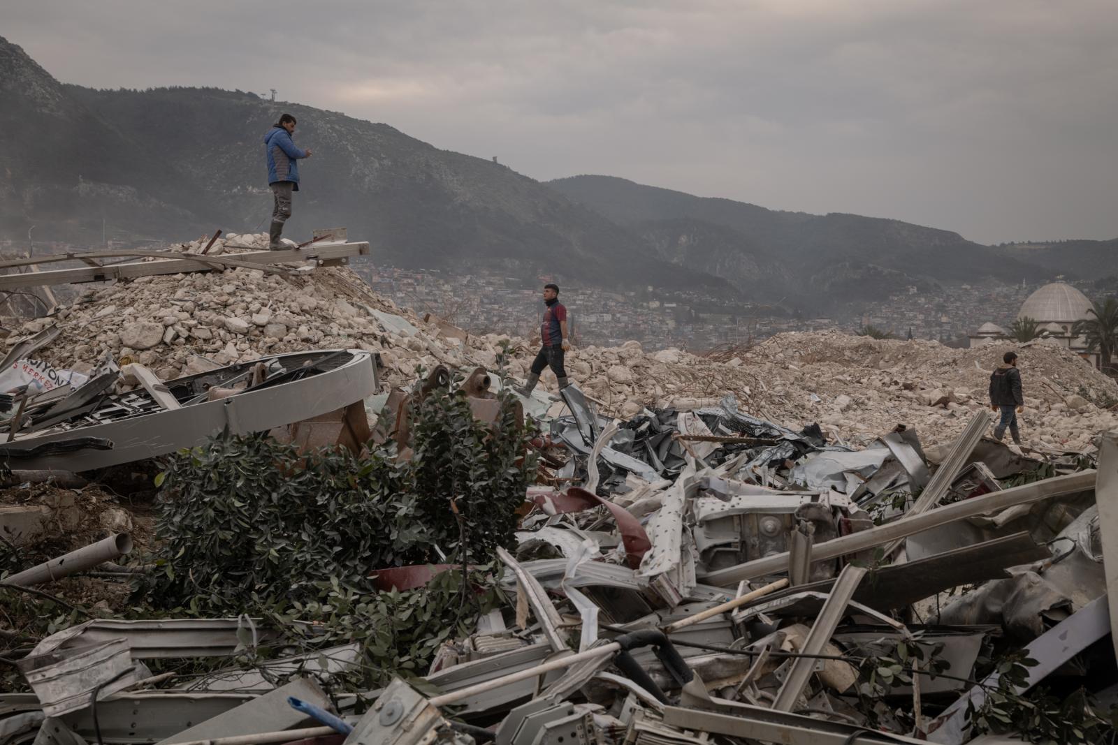 Construction workers are seen a...sands of years, was devastated.