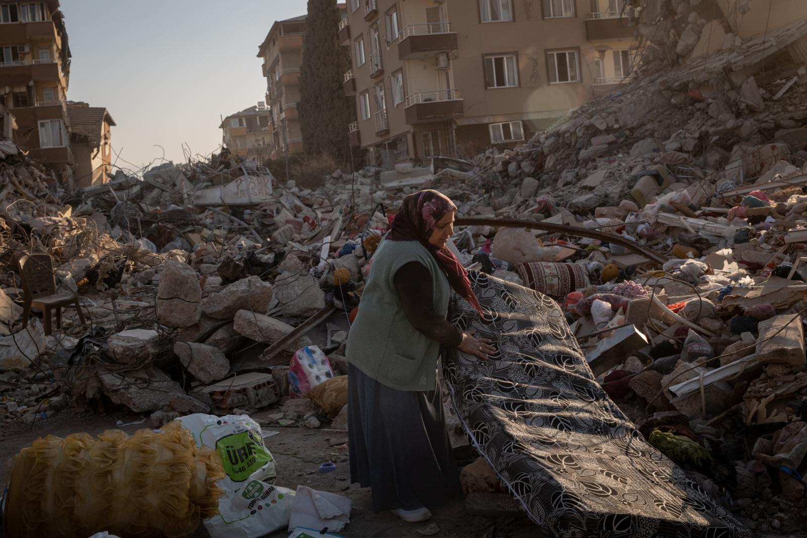 The Tremble of the Earth - A resident salvaged whatever belongings she could from...