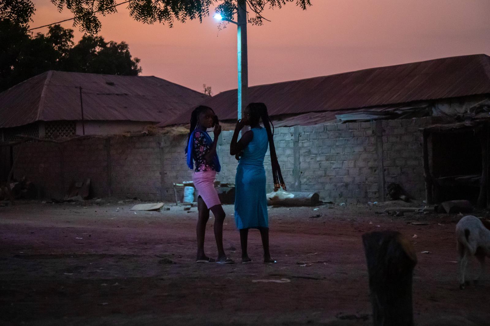 Women meet at nightfall in the ... village Nymanarr in The Gambia