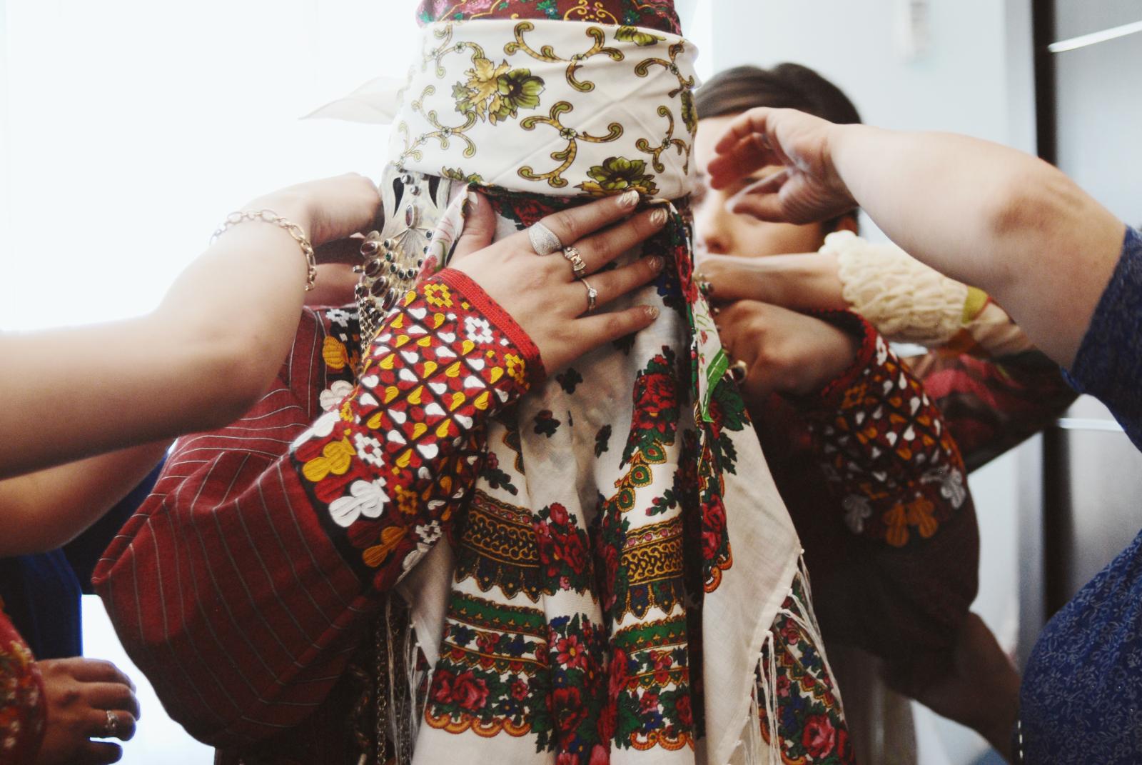 Turkmeni bride being adorned wit_ for her wedding. Ashgabat, 2011