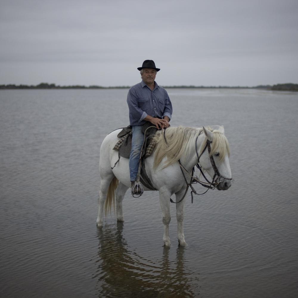 Camargue Climate Change - Frederic Raynaud poses for a portrait with his horse...