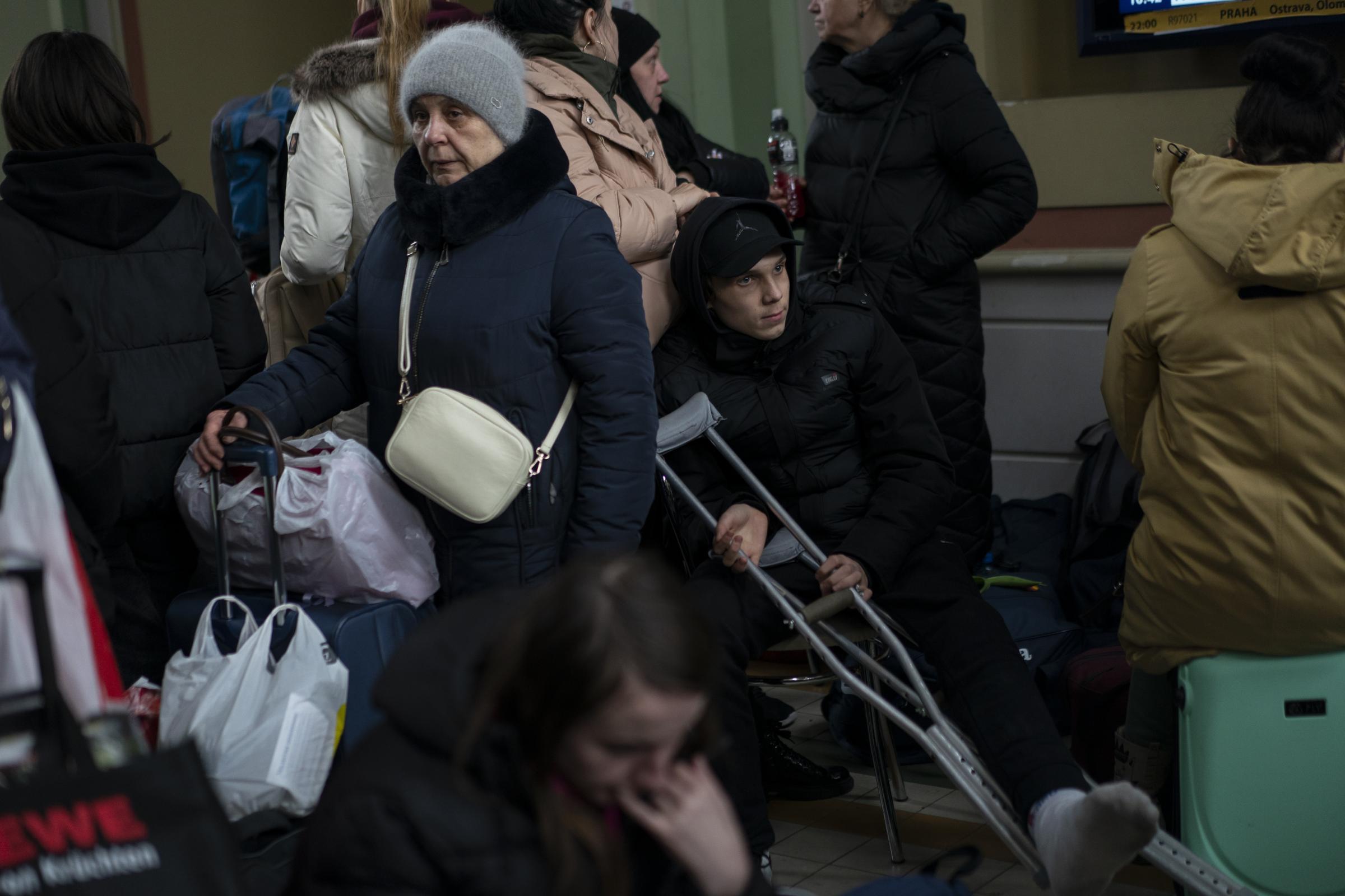Singles - People, who have fled from Ukraine, wait in the train...