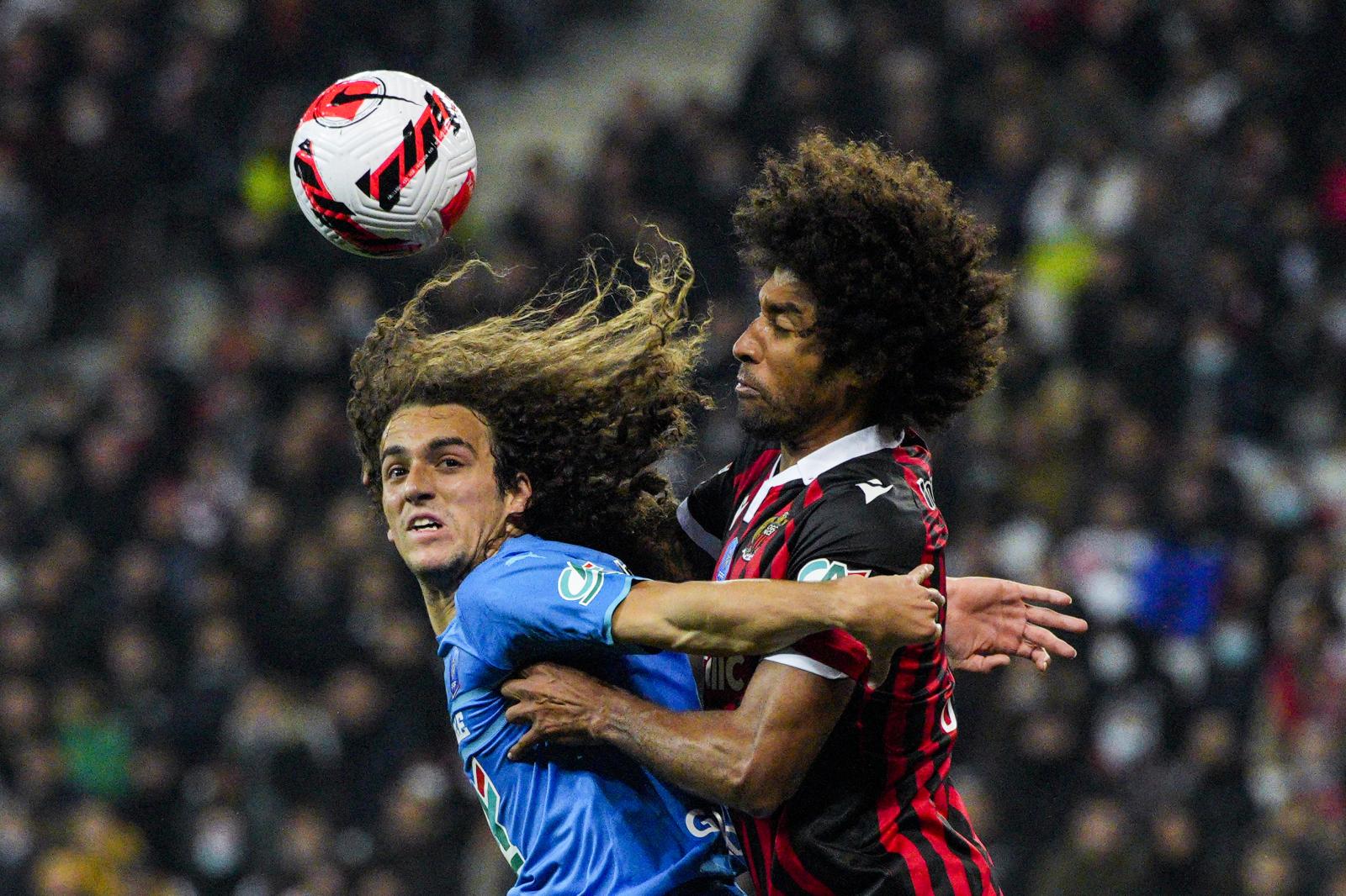 Sports - Marseille's Matteo Guendouzi, left, fights for the...