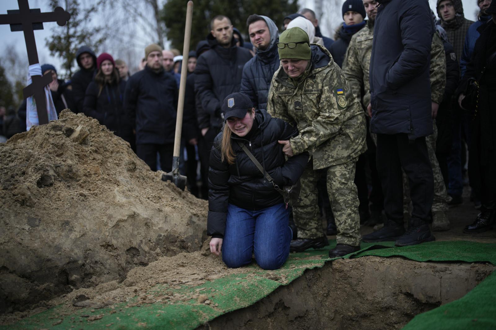 Anna Korostenska, 24, drops to ...AP Photo/Daniel Cole) Bucha UKR