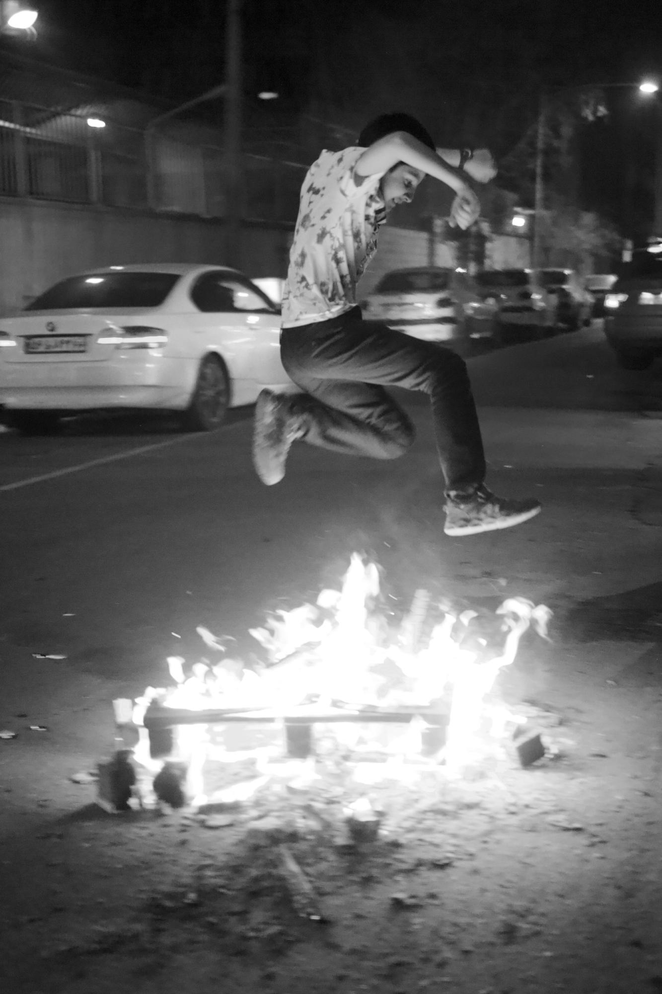 Iraniyat ("being Iranian") -    An Iranian boy celebrates the fire festival of...