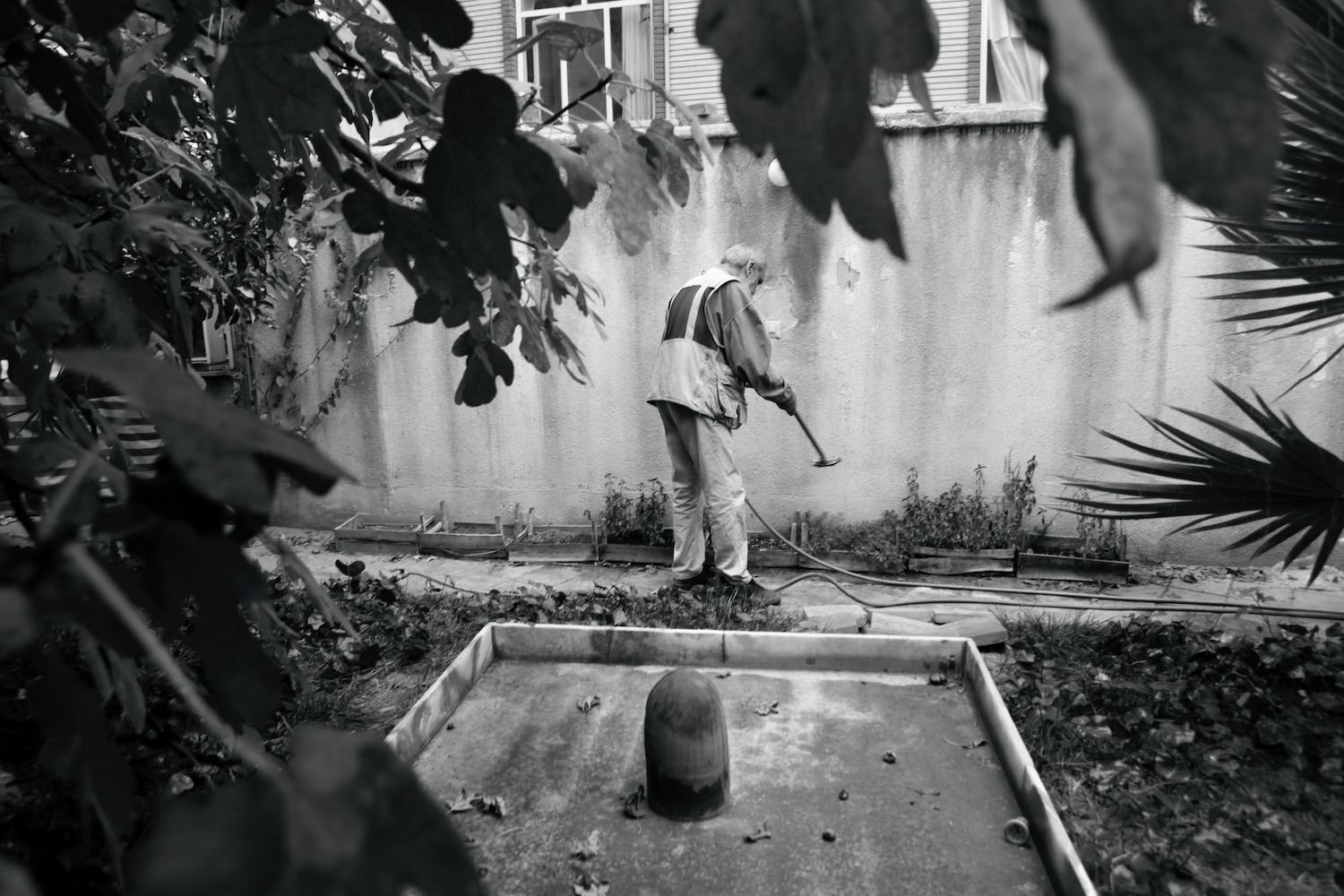 No Regret -   Kamran watering his little garden. Tehran, Iran  