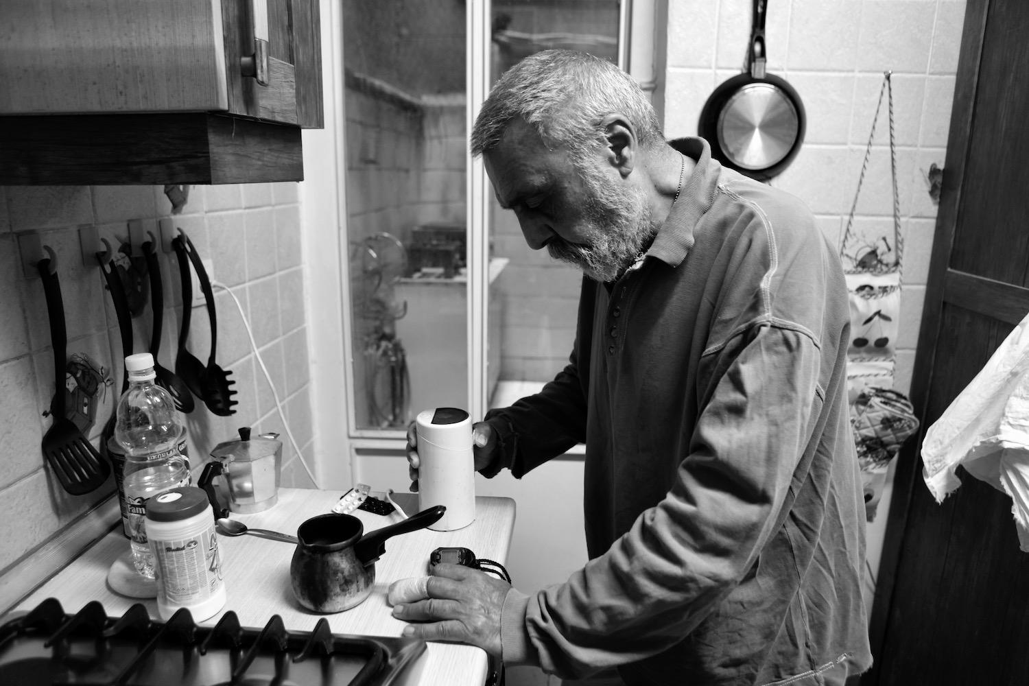 No Regret -   Kamran preparing coffee in his kitchen. Tehran, Iran  