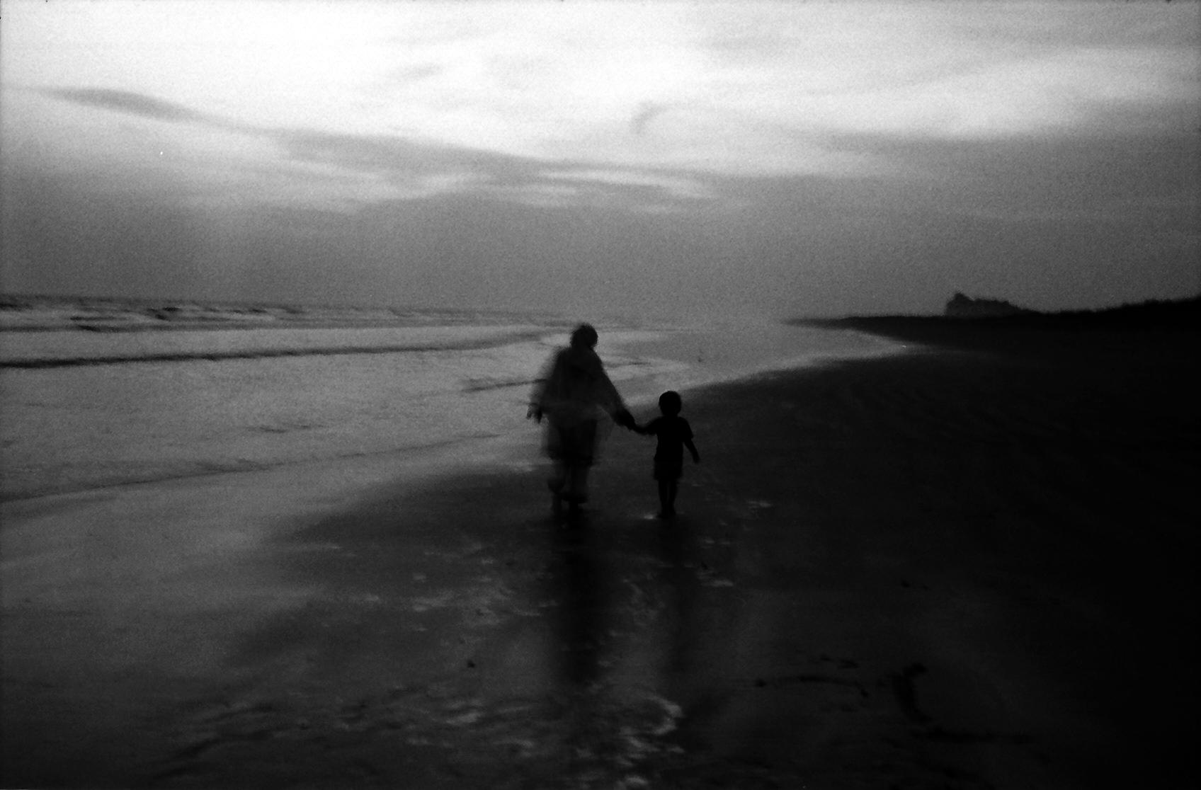 Waiting for Better Days - The child walks with his father's colleague' wife...