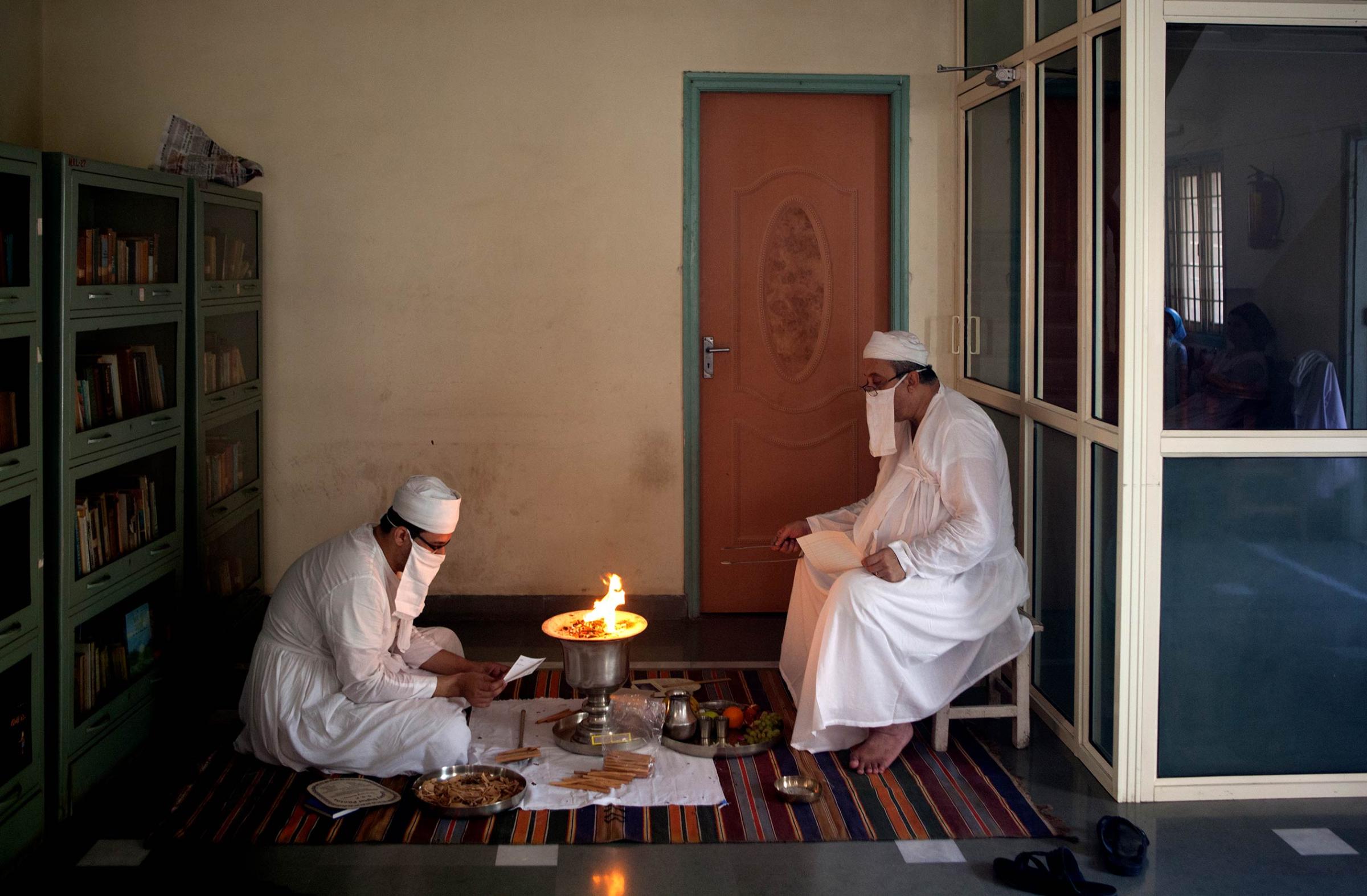 In memory of Greater Iran: The Zoroastrians of Navsari - Priests doing the Jashan ceremony at the house of Mrs...