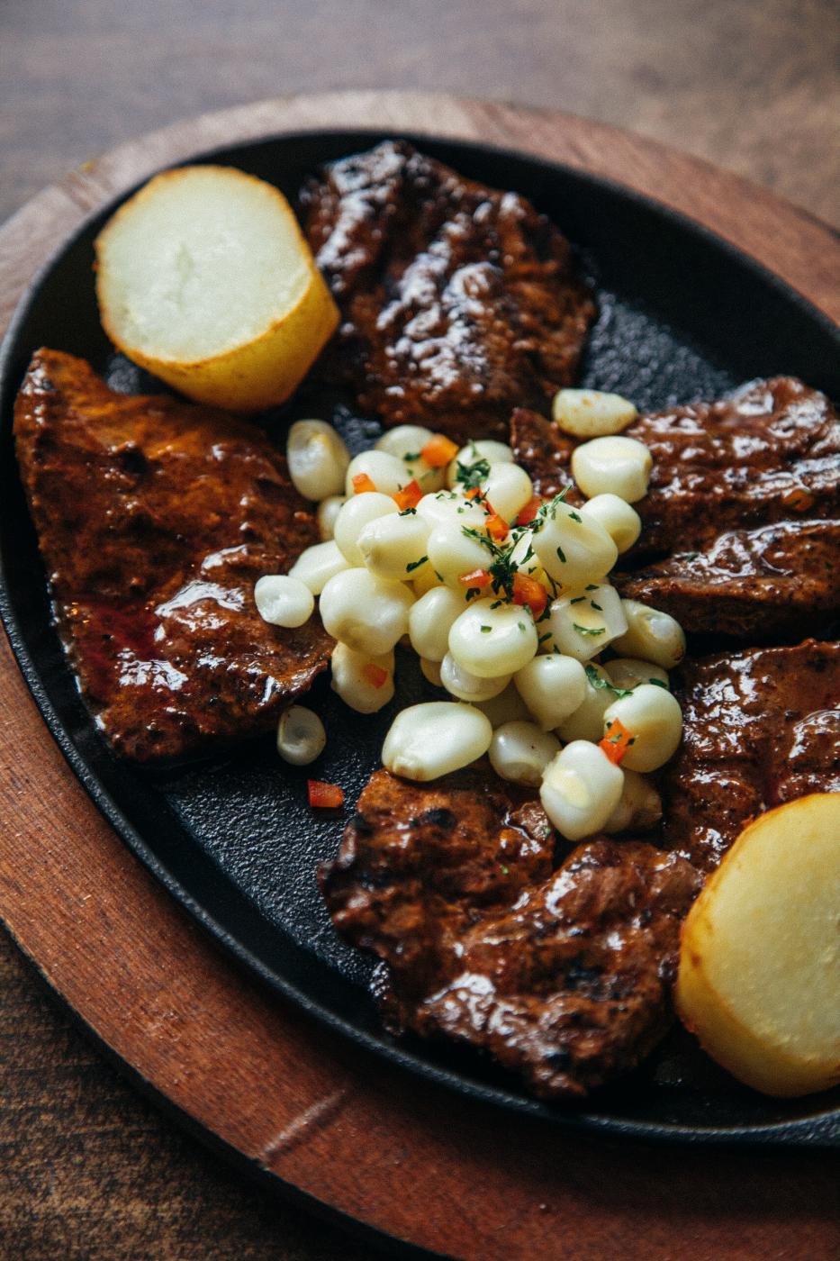 Image from FOOD - Anticuchos, a signature Andes plate, sits on a table at...