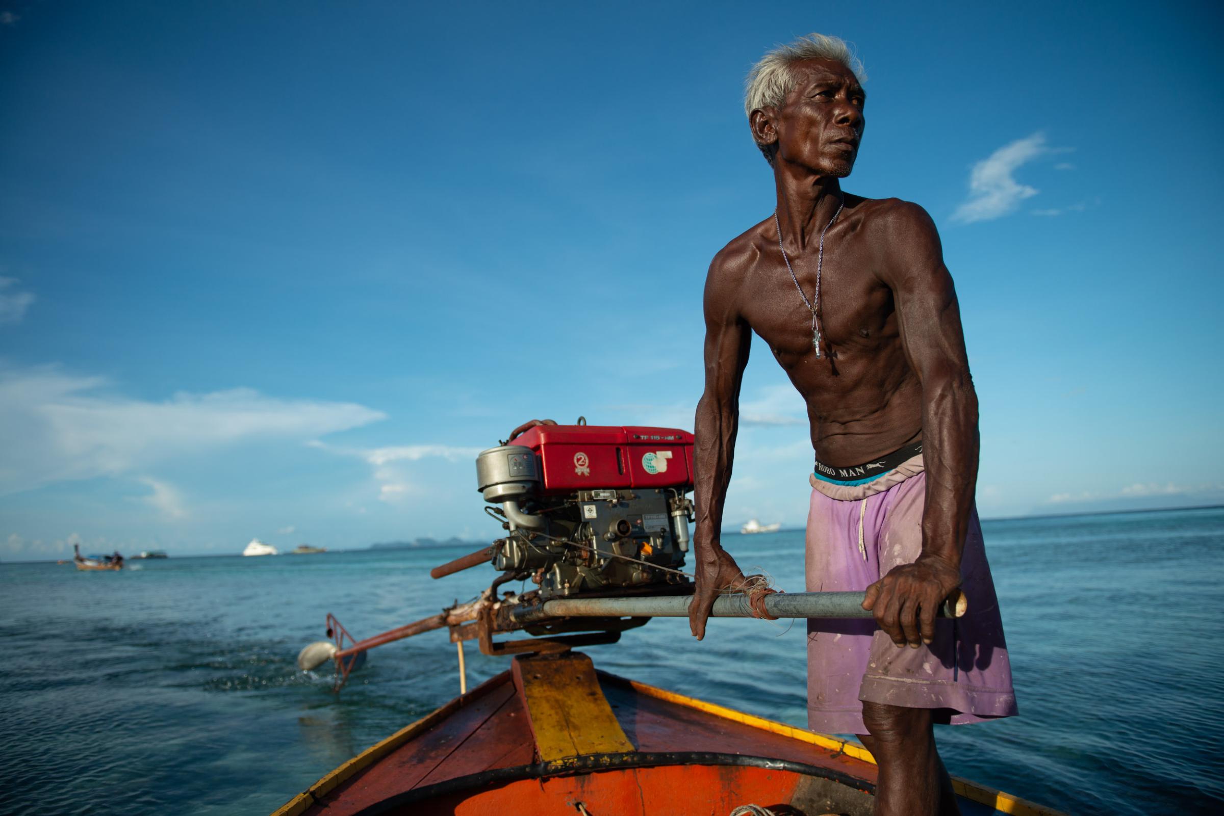 Lipe Island - A local sea gypsy makes his way home after accompanying...