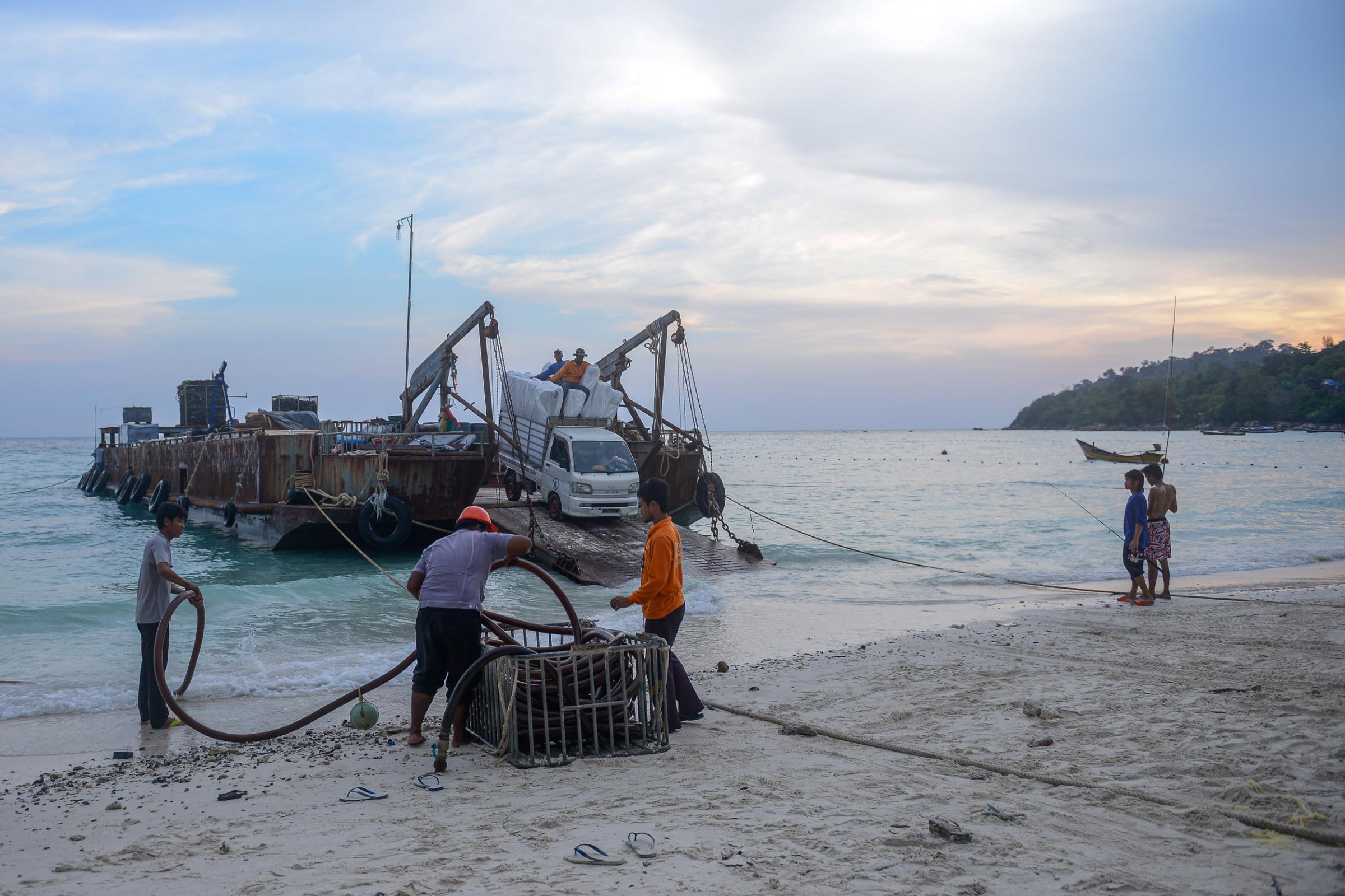 Lipe Island - A truck transport construction materials from the boat to...